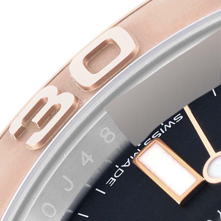 The image shows a close-up view of the bezel and part of the dial of a Rolex Yacht-Master 116621 Men's Steel and Gold (two tone) Black Dial 116621 Men's Steel and Gold (two tone) Black Dial watch.