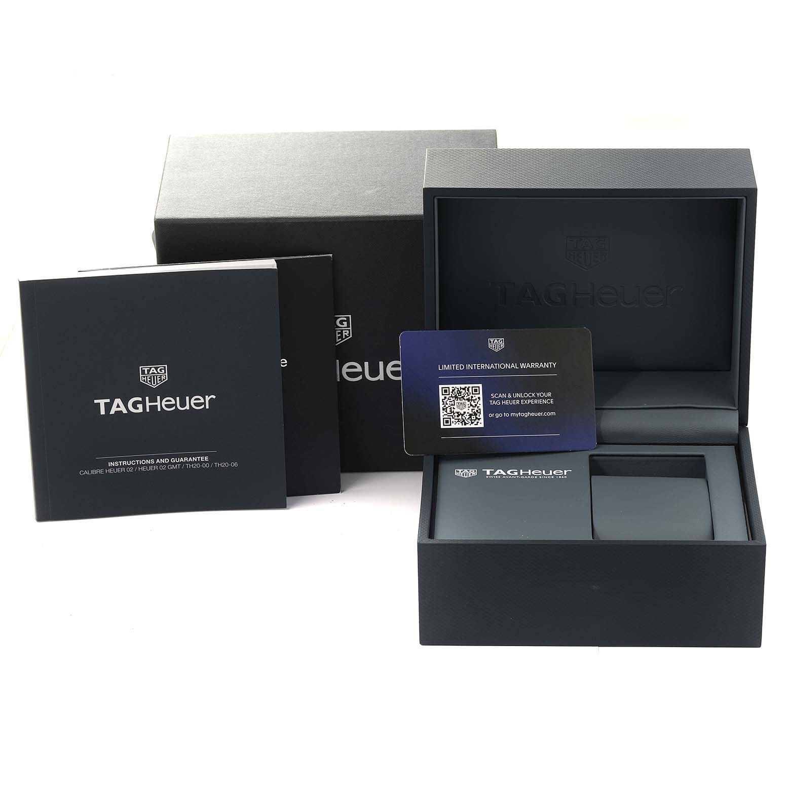 The image shows the packaging, instruction manuals, and warranty card for a Tag Heuer Carrera CBN2A1N Men's Stainless Steel Green Dial CBN2A1N Men's Stainless Steel Green Dial model watch.