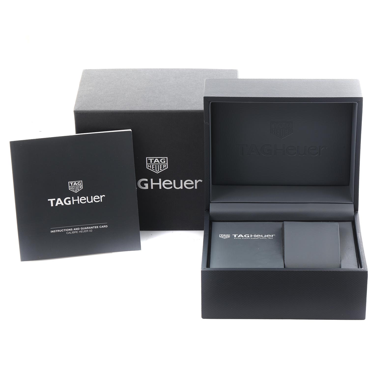 The image shows an open box, booklet, and accessories for a Tag Heuer Carrera CBG2A10.FT6168 Men's Stainless Steel Transparent Dial CBG2A10.FT6168 Men's Stainless Steel Transparent Dial watch from a front angle.