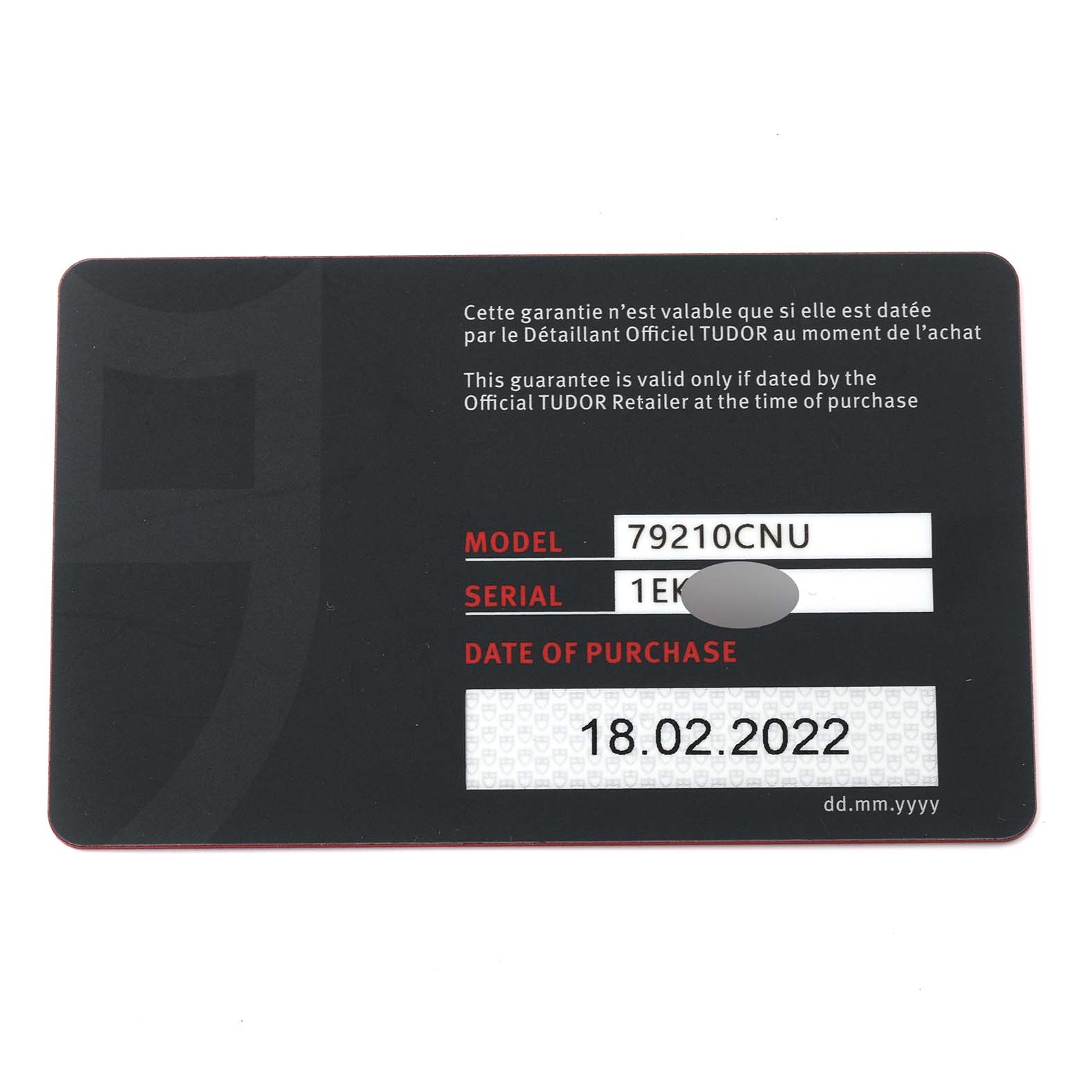 This image shows the warranty card for the Tudor Heritage Black Bay 79210CNU Men's Ceramic Black Dial 79210CNU Men's Ceramic Black Dial model 79210CNU, displaying the model, serial number, and date of purchase.