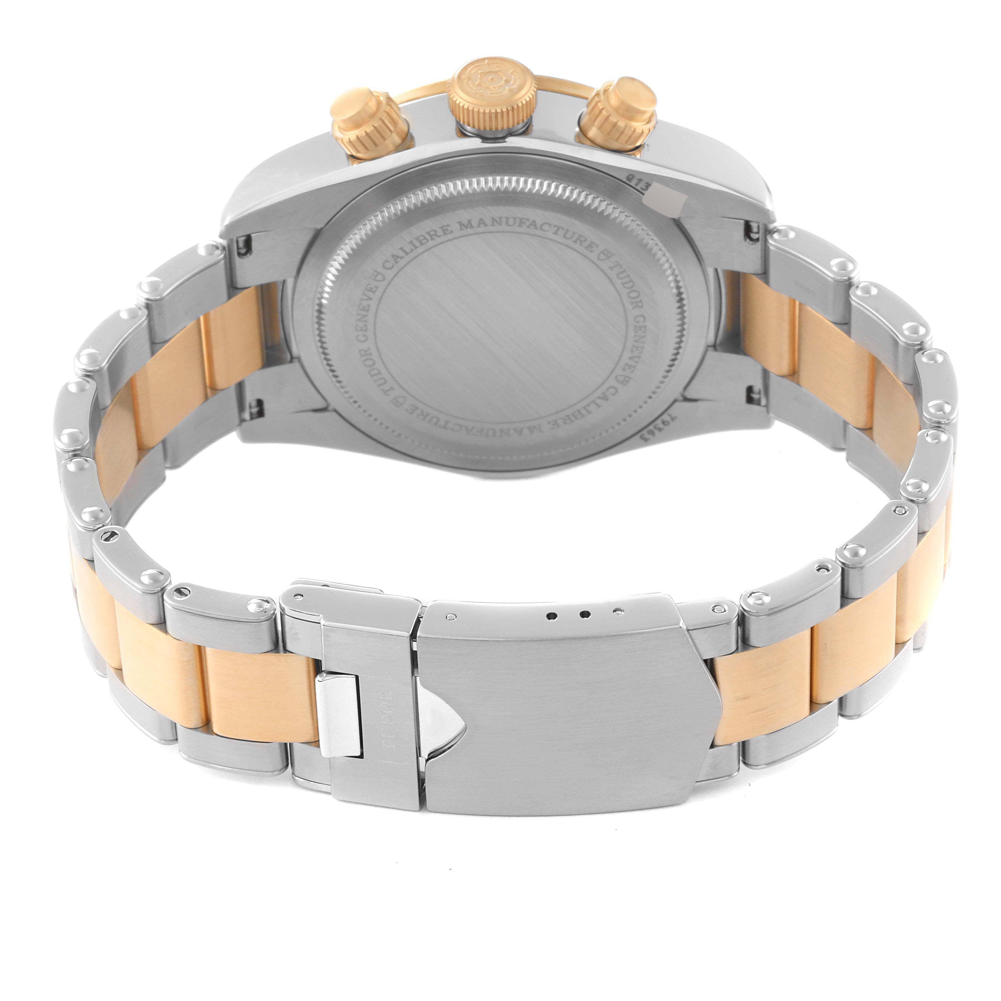 The image shows the back view of the Tudor Heritage Black Bay 79363N Men's Steel and Gold (two tone) Black Dial 79363N Men's Steel and Gold (two tone) Black Dial watch, highlighting its case back, crown, and bracelet clasp.