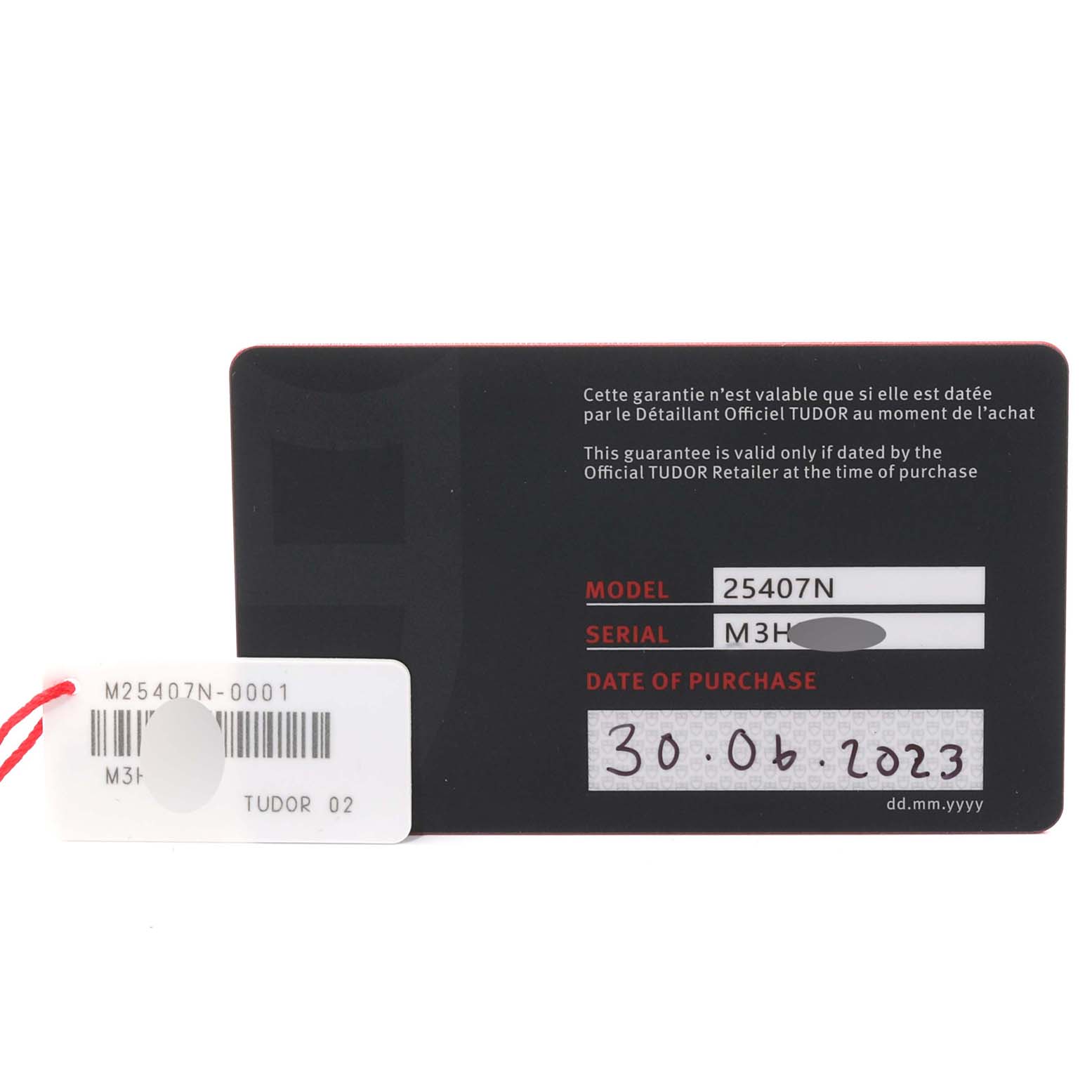 This image shows the guarantee card and tag for the Tudor Pelagos 25407N-0001 Men
s Titanium Black Dial 25407N-0001 Men
s Titanium Black Dial model 25407N, with purchase date 30.06.2023.