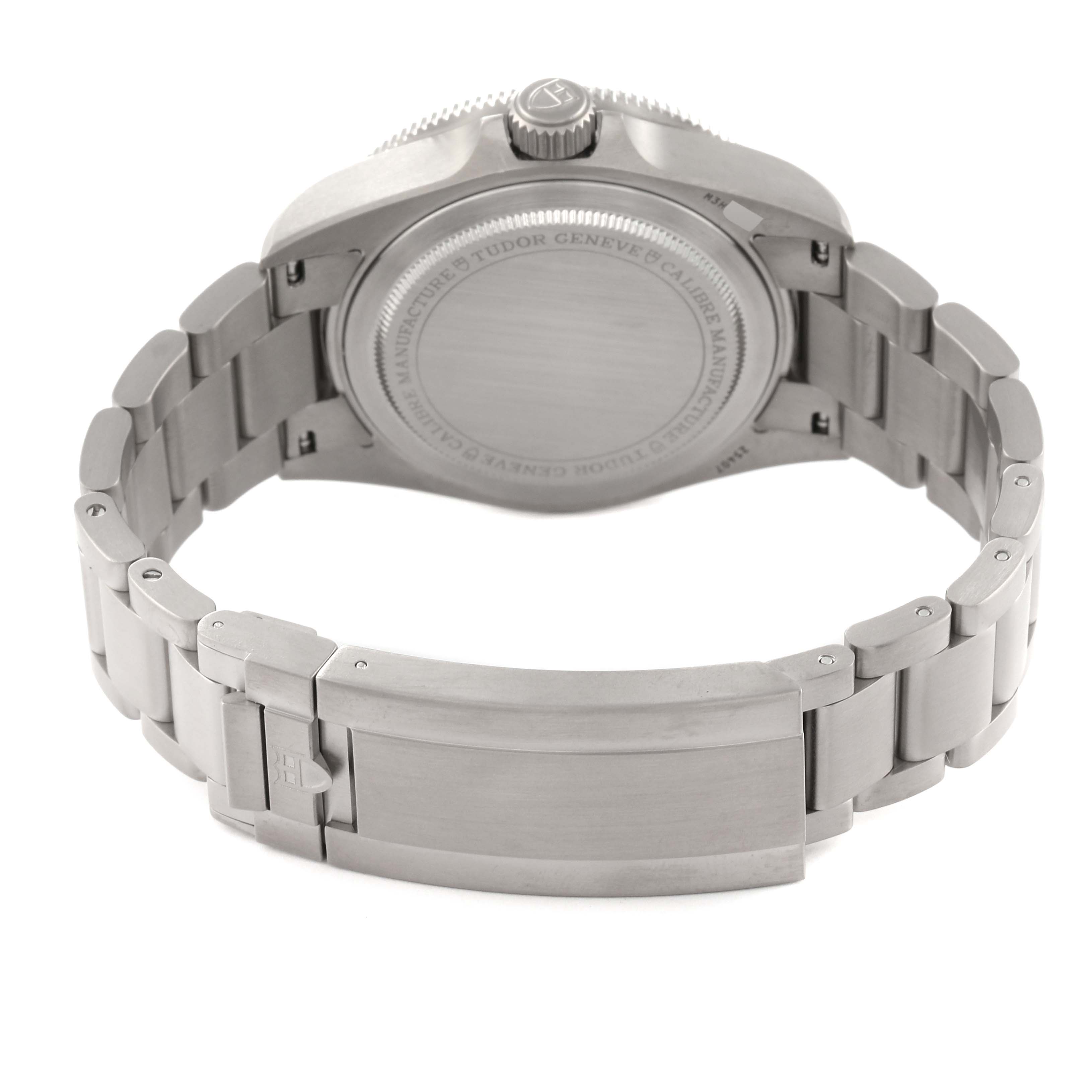 The image shows the back view of the Tudor Pelagos 25407N-0001 Men
s Titanium Black Dial 25407N-0001 Men
s Titanium Black Dial watch, including the case back and bracelet with a deployment clasp.