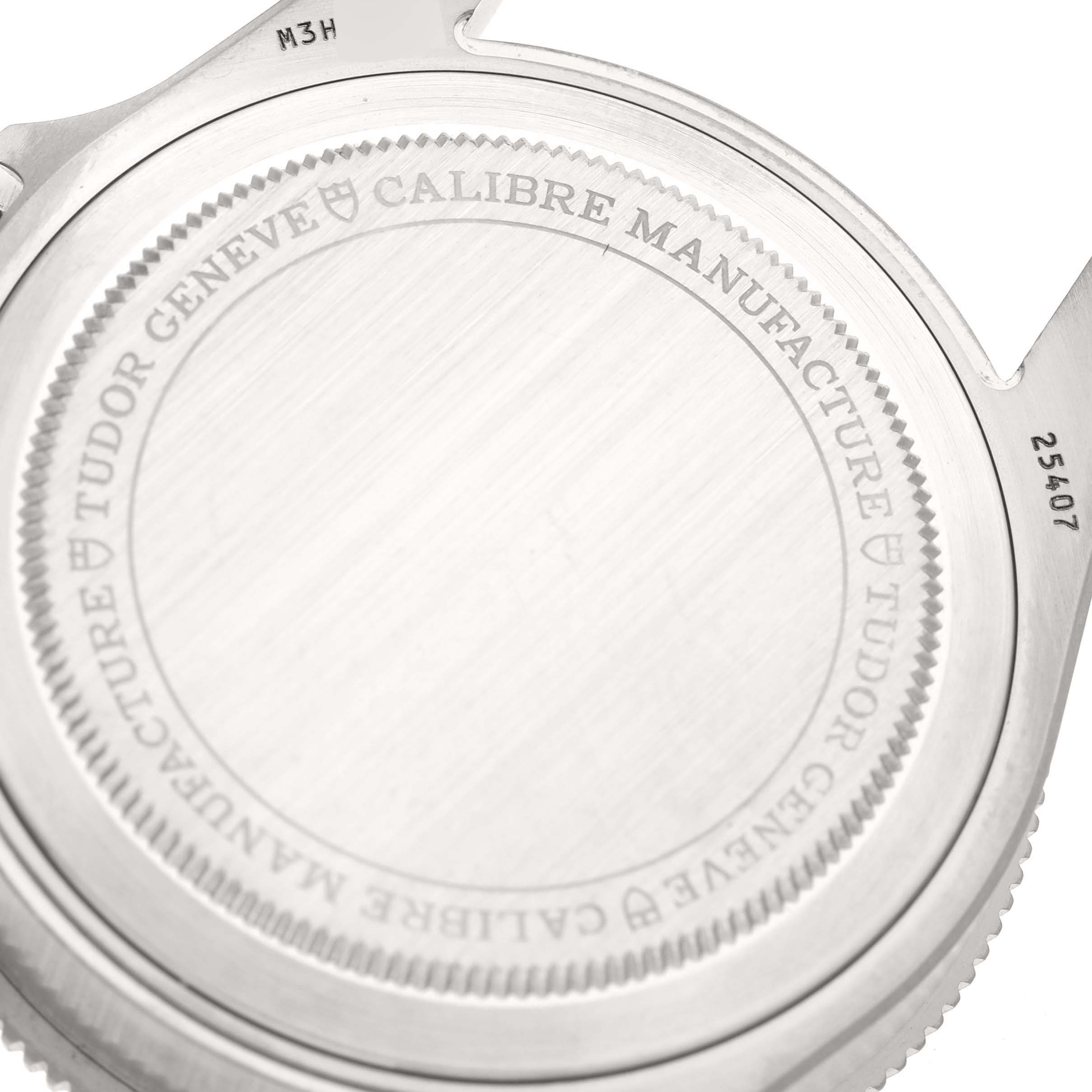 The image shows the back case of a Tudor Pelagos 25407N-0001 Men
s Titanium Black Dial 25407N-0001 Men
s Titanium Black Dial watch, highlighting the engraved details and serial numbers.