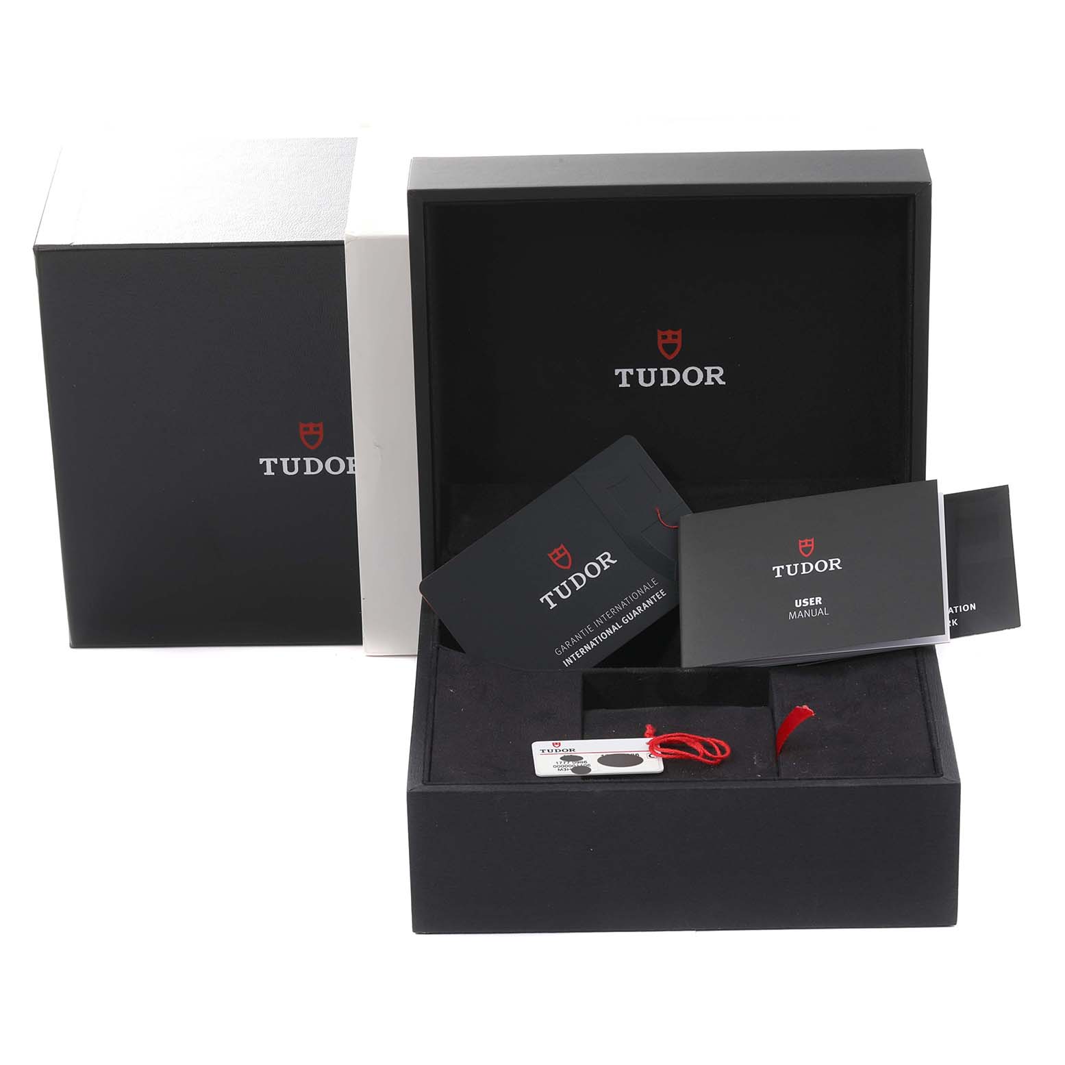 This image shows the packaging, manuals, warranty card, and accessories for a Tudor Pelagos 25407N-0001 Men
s Titanium Black Dial 25407N-0001 Men
s Titanium Black Dial watch.