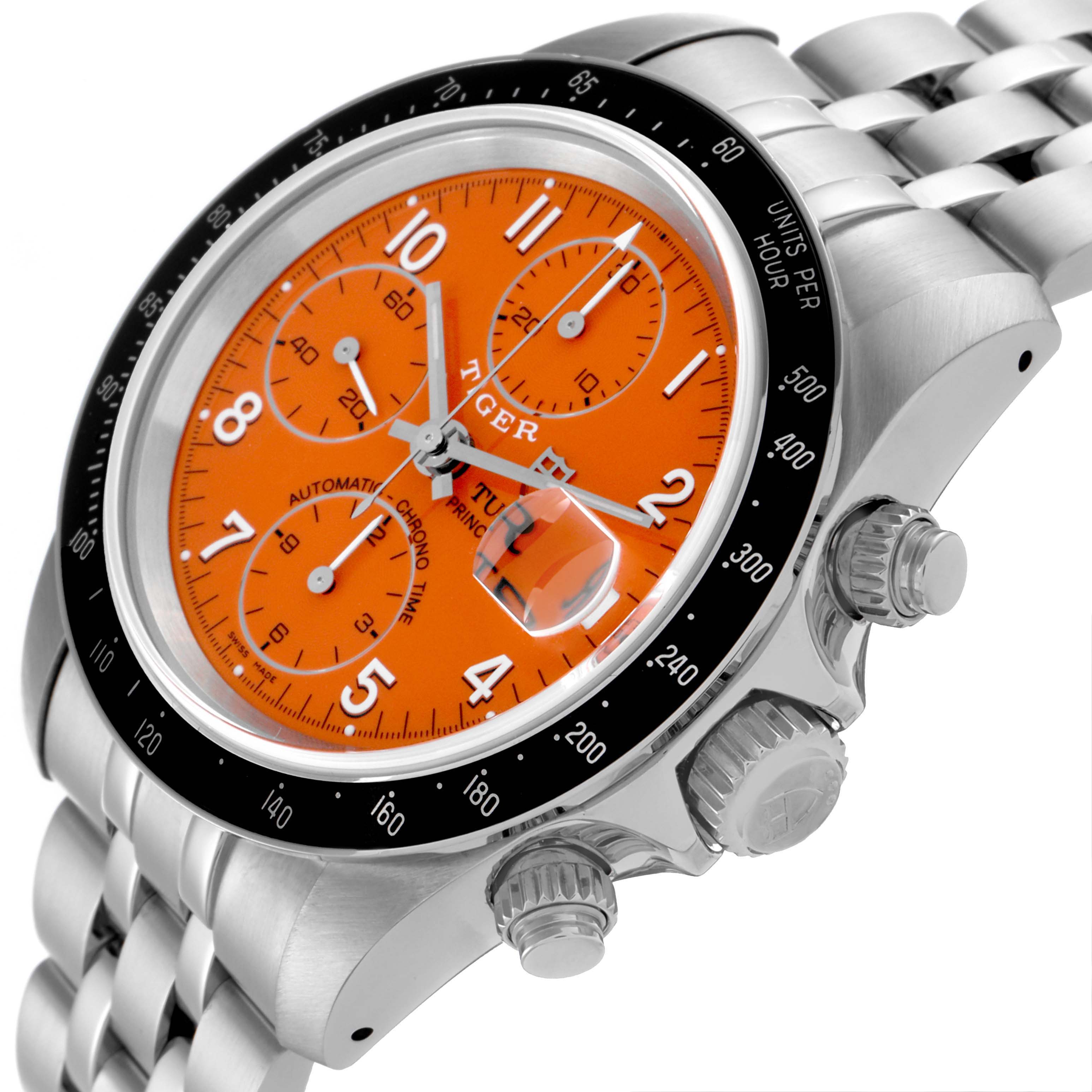 The Tudor Tiger 79260 Men's Stainless Steel Orange Dial 79260 Men's Stainless Steel Orange Dial watch is shown at an angle highlighting its orange dial, chronograph sub-dials, bezel, and stainless steel bracelet.