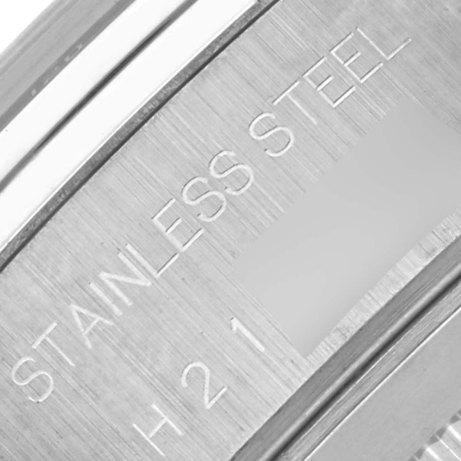 The image shows an engraved stainless steel back of the Tudor Tiger 79260 Men's Stainless Steel Orange Dial 79260 Men's Stainless Steel Orange Dial model watch.