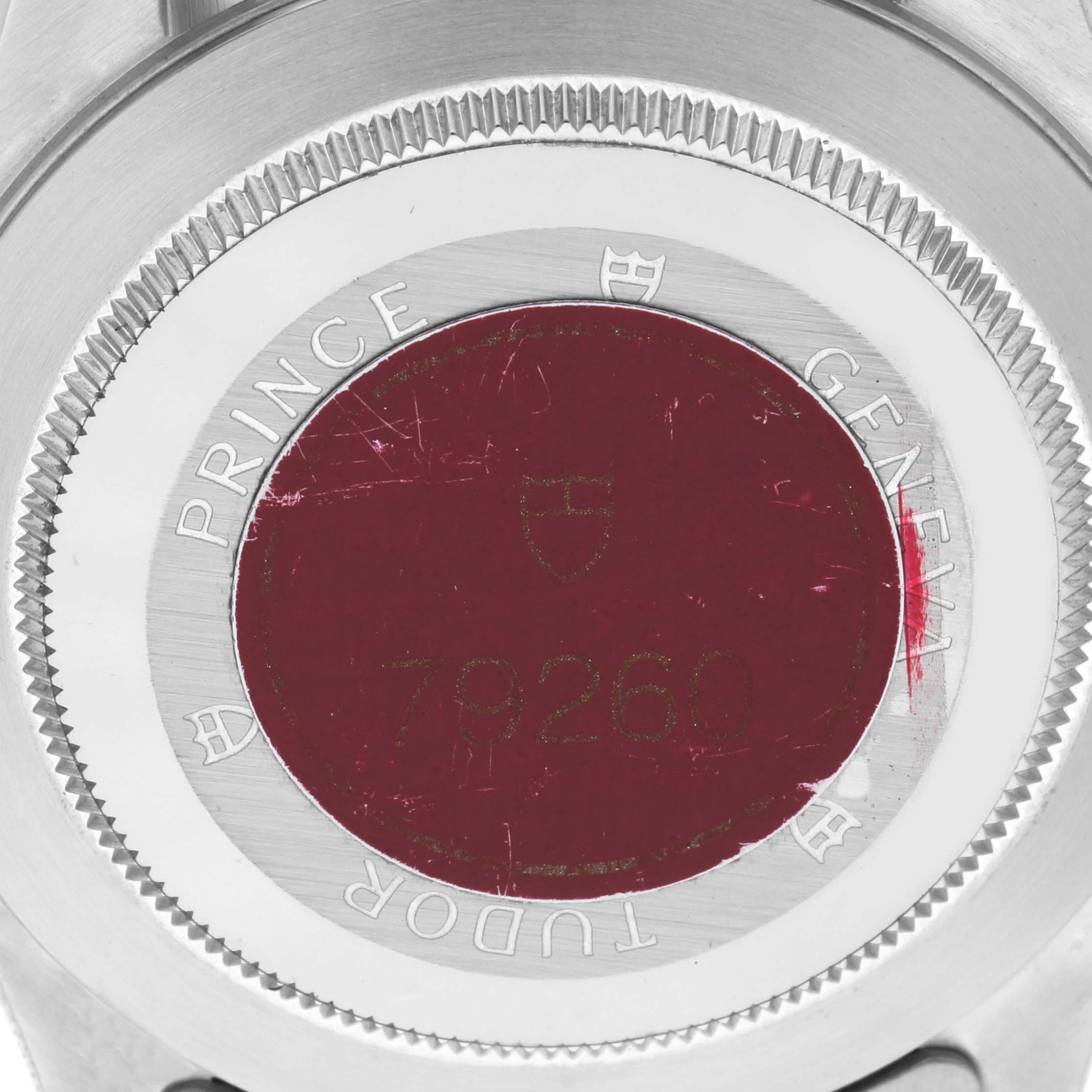 The image shows the case back of a Tudor Tiger 79260 Men's Stainless Steel Orange Dial 79260 Men's Stainless Steel Orange Dial model, featuring its engraving and the surrounding bezel.