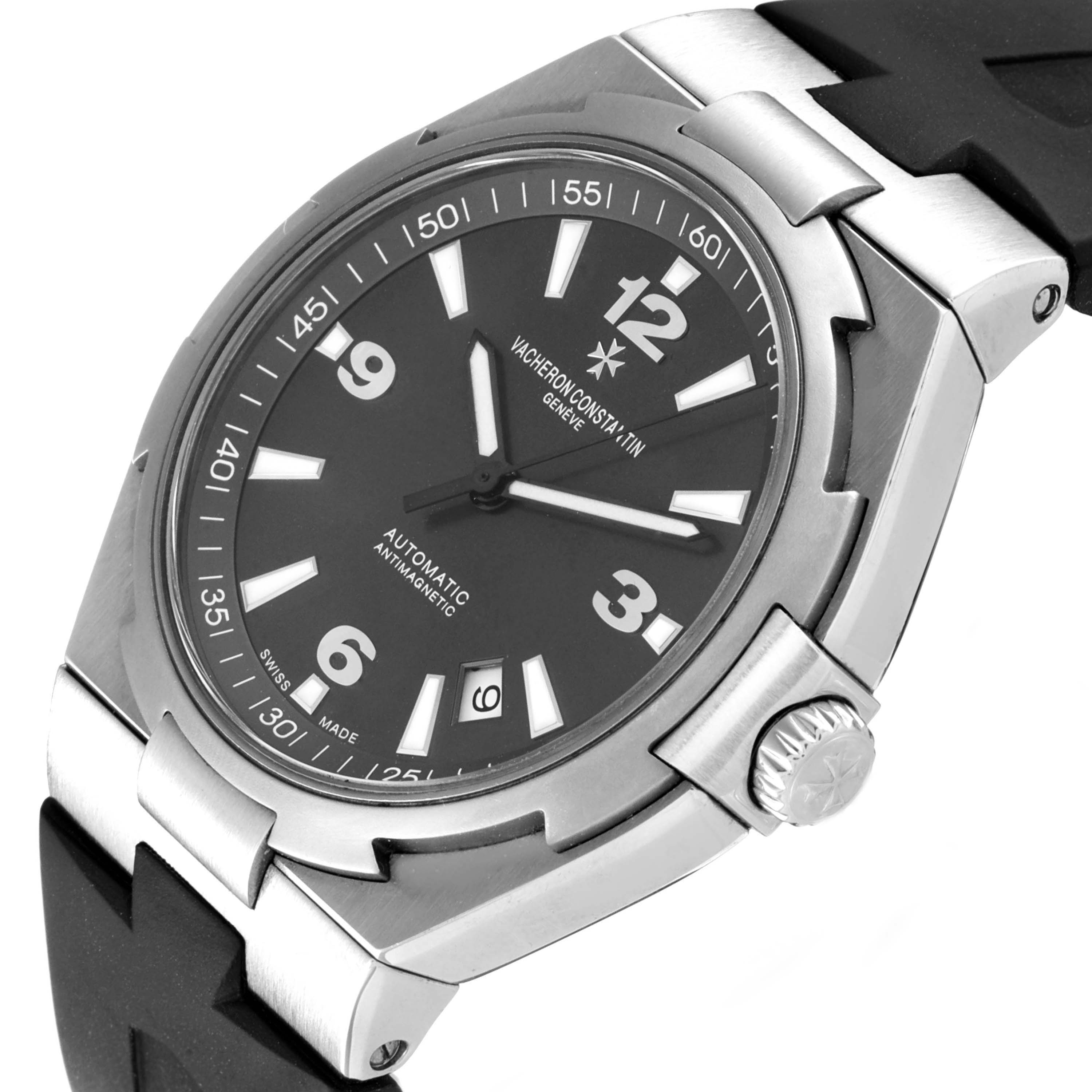 The Vacheron Constantin Overseas 47040 Men's Stainless Steel Grey Dial watch is shown at a tilted angle, displaying the face, bezel, crown, and part of the strap.