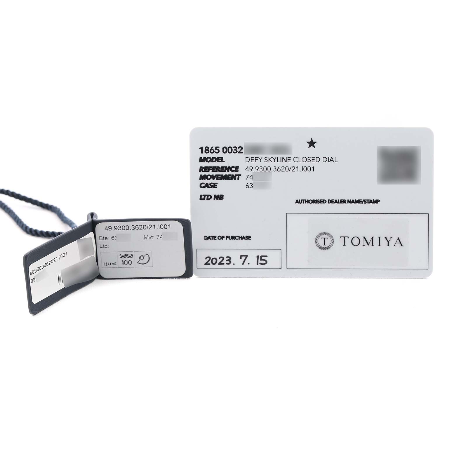 The image shows warranty cards and tags for the Zenith Defy Skyline Black Ceramic Black Dial Men's Watch model 49.9300.3620.