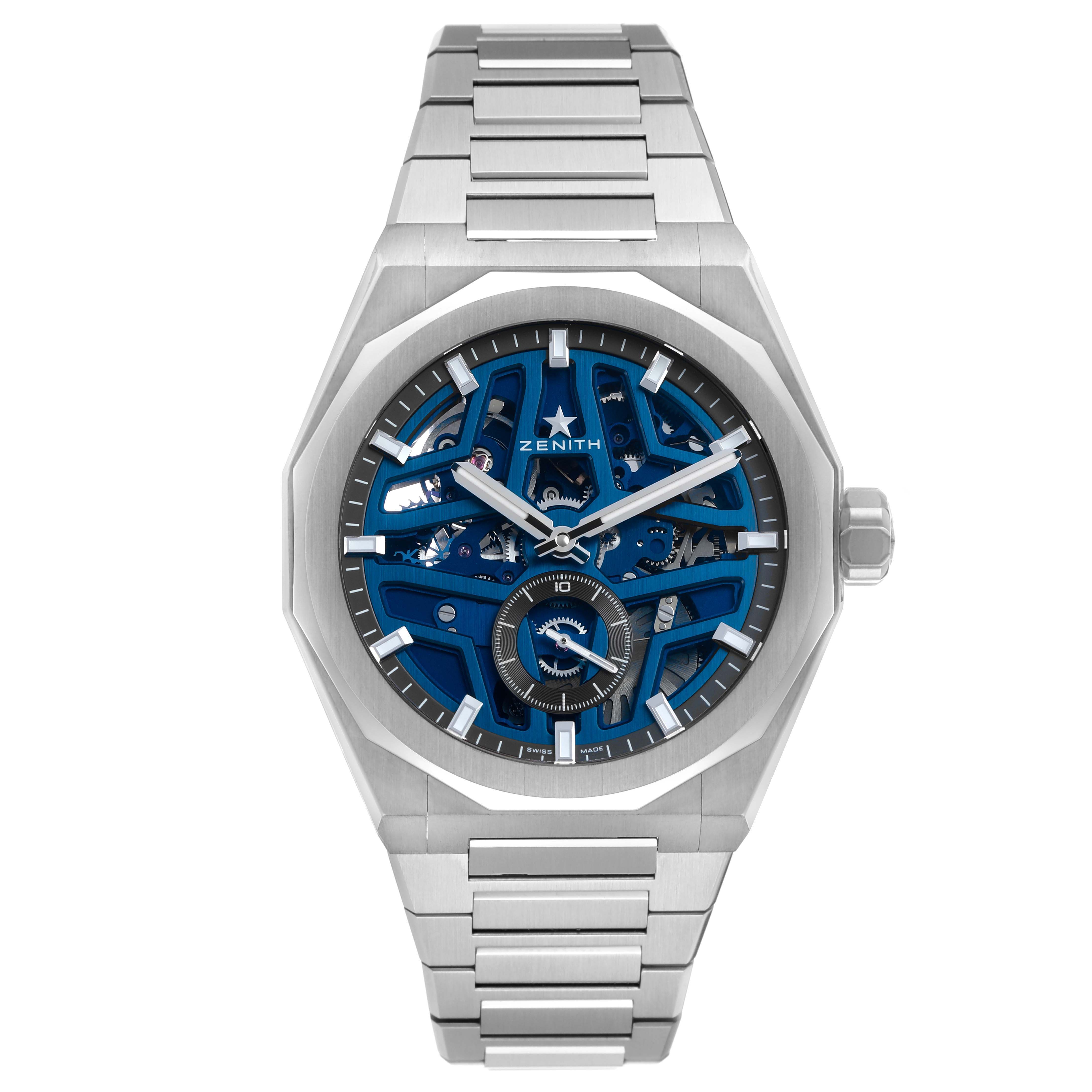 The Zenith Defy 03.9300.3620 / 79.I001 Men's Stainless Steel Blue Dial watch is shown front-facing, with a visible face and bracelet, highlighting its skeleton design and dial details.