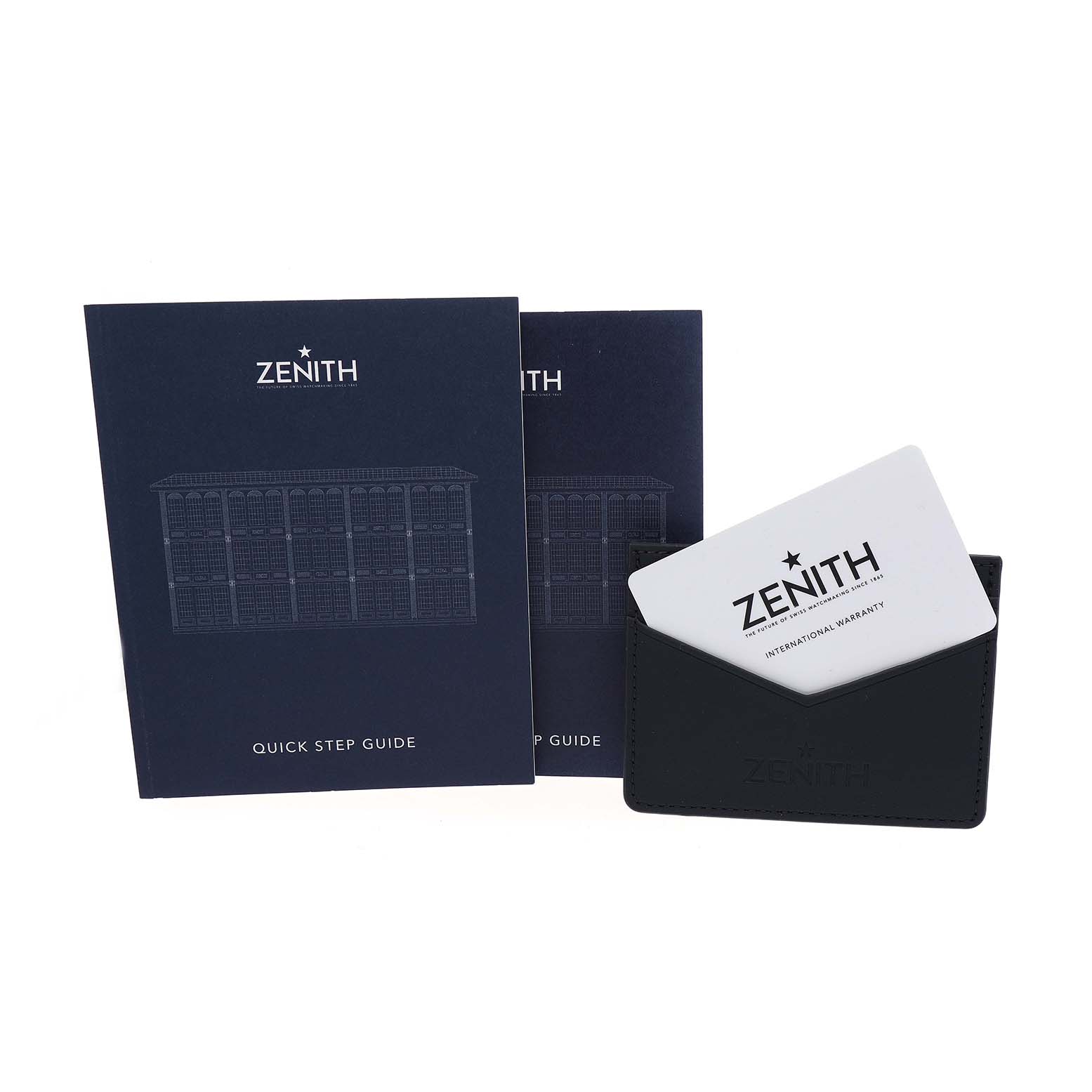 The image shows the Zenith Defy 03.9300.3620 / 79.I001 Men's Stainless Steel Blue Dial model's watch accessories including a quick step guide, a warranty card, and a card holder.