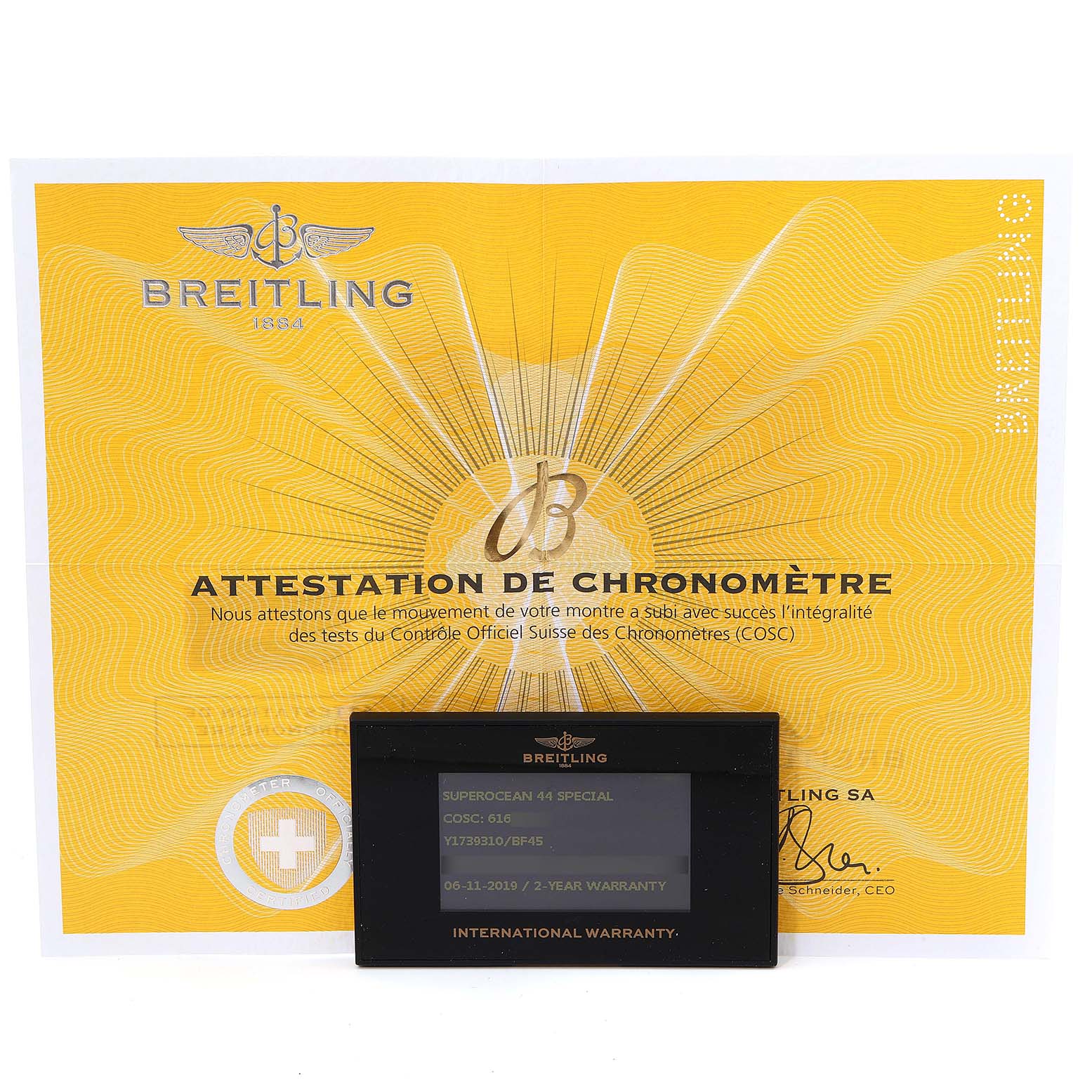 The image shows the warranty card and a chronometer certificate for the Breitling Superocean Y17393 Men's Stainless Steel Black Dial Y17393 Men's Stainless Steel Black Dial model.