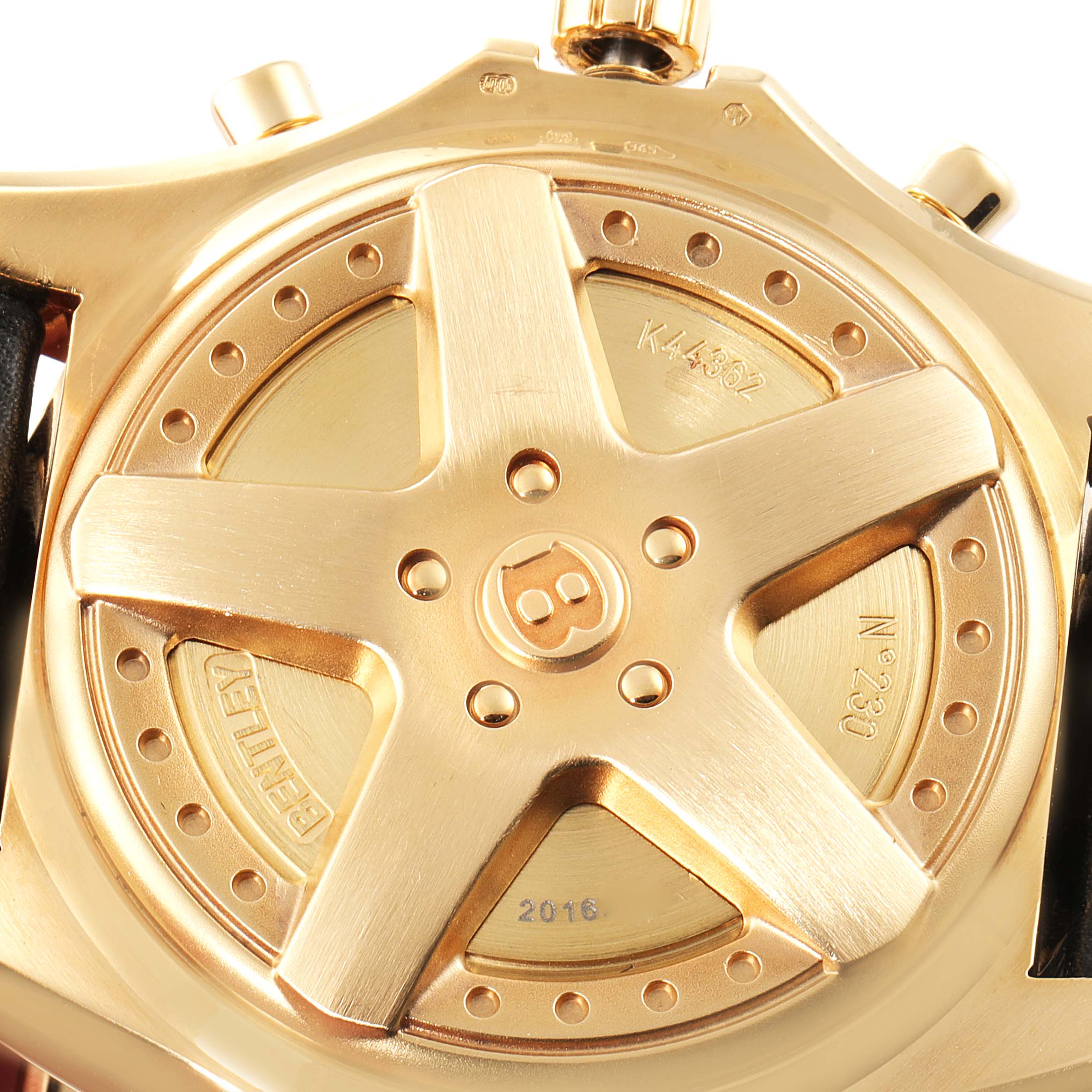 The image shows the case back of a Bentley model by Breitling, highlighting its distinctive design and engravings.