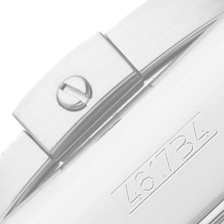 The image shows a close-up of the screw and engraved serial number on the case back of the Breitling Chronomat AB0115 Men
s Stainless Steel Blue Dial AB0115 Men
s Stainless Steel Blue Dial watch.