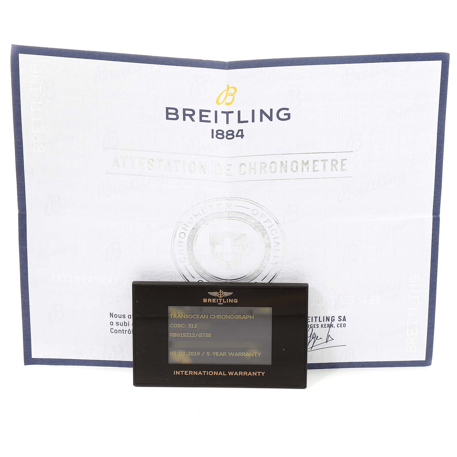 The image shows a warranty card and certificate for the Breitling Transocean RB0152 Men's Rose Gold Silver Dial RB0152 Men's Rose Gold Silver Dial model, displayed from a head-on angle.