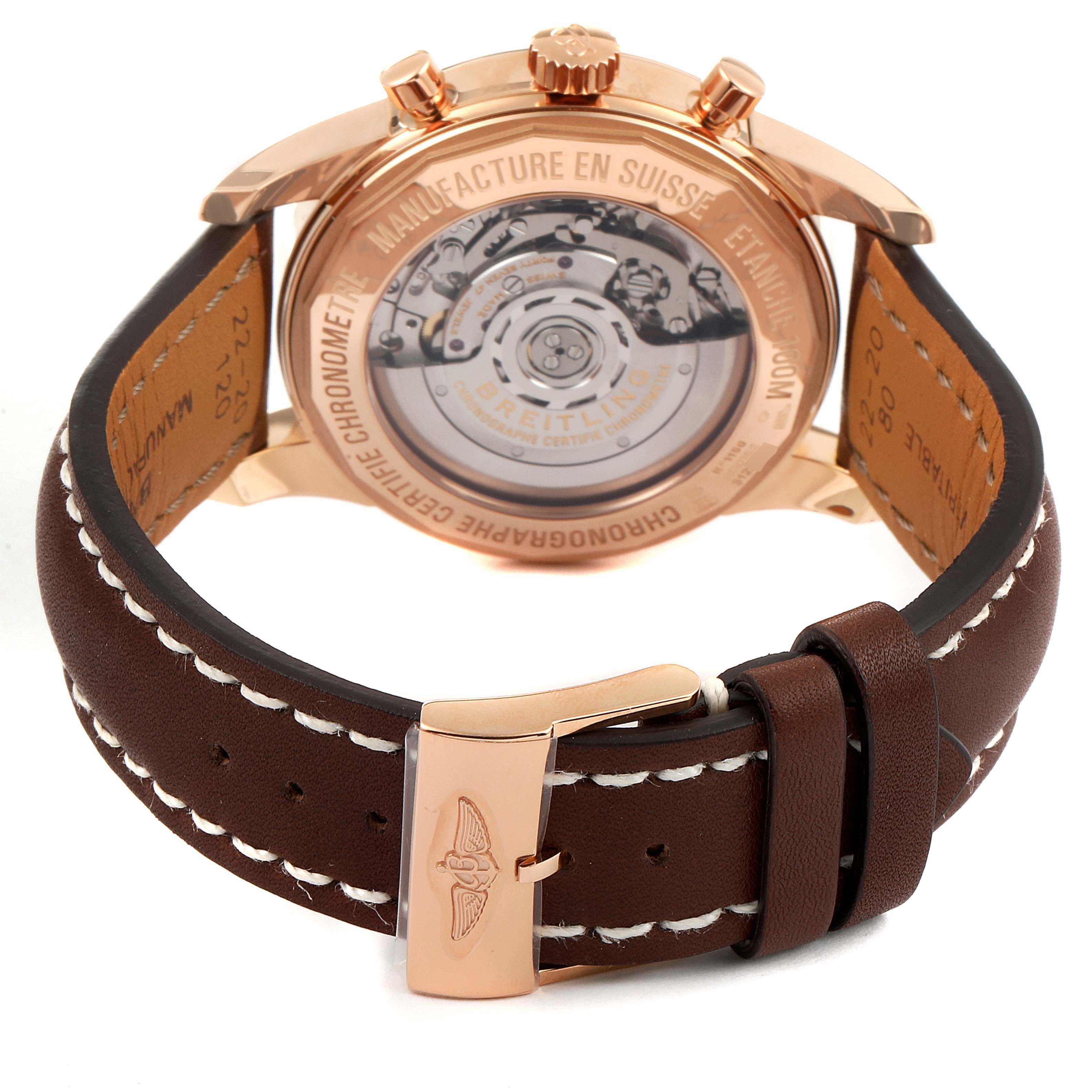 The image shows the back view of the Breitling Transocean RB0152 Men's Rose Gold Silver Dial RB0152 Men's Rose Gold Silver Dial watch, highlighting its movement and brown leather strap with a rose gold buckle.