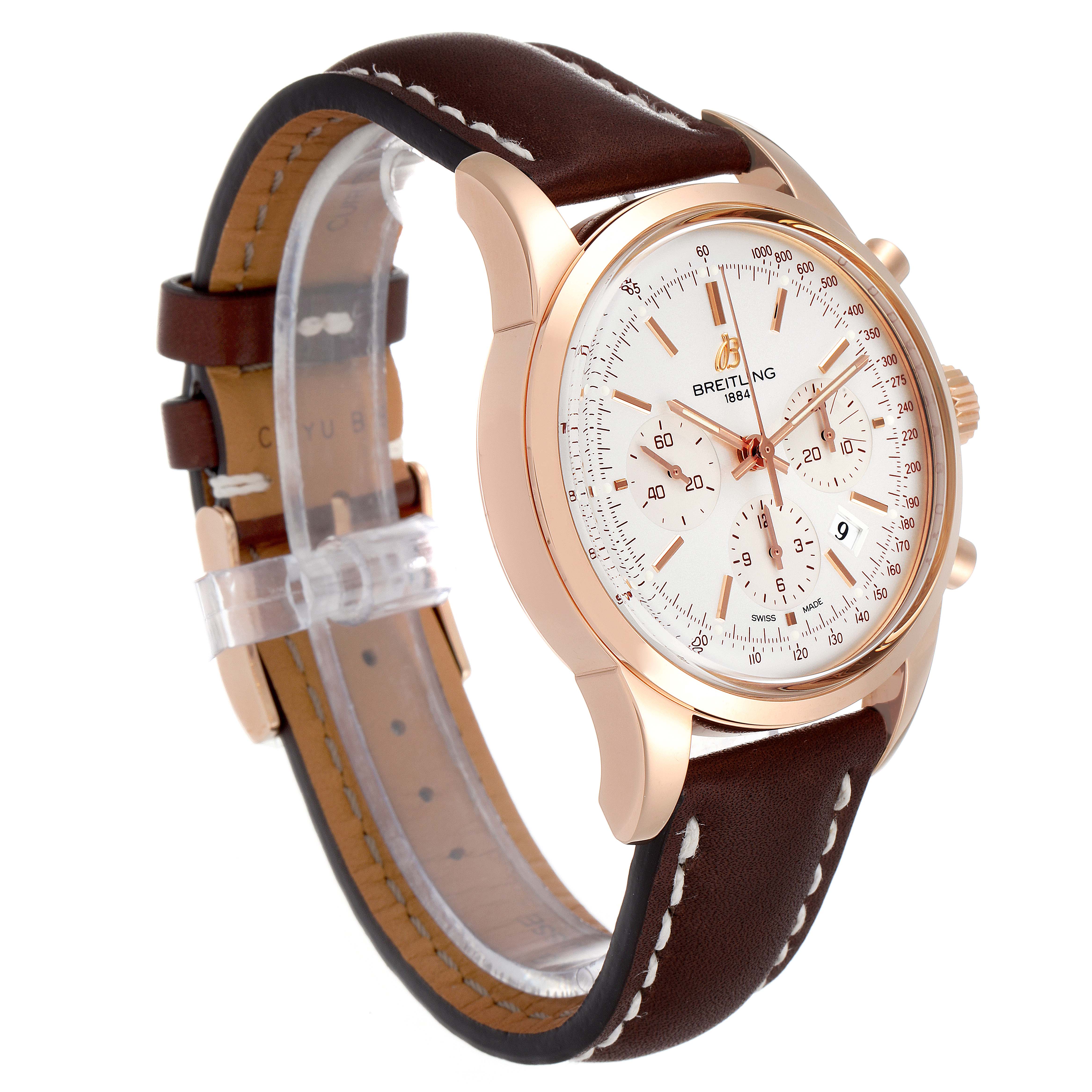 This image shows a front-side angle of the Breitling Transocean RB0152 Men's Rose Gold Silver Dial RB0152 Men's Rose Gold Silver Dial watch, highlighting its dial, rose gold case, and brown leather strap.