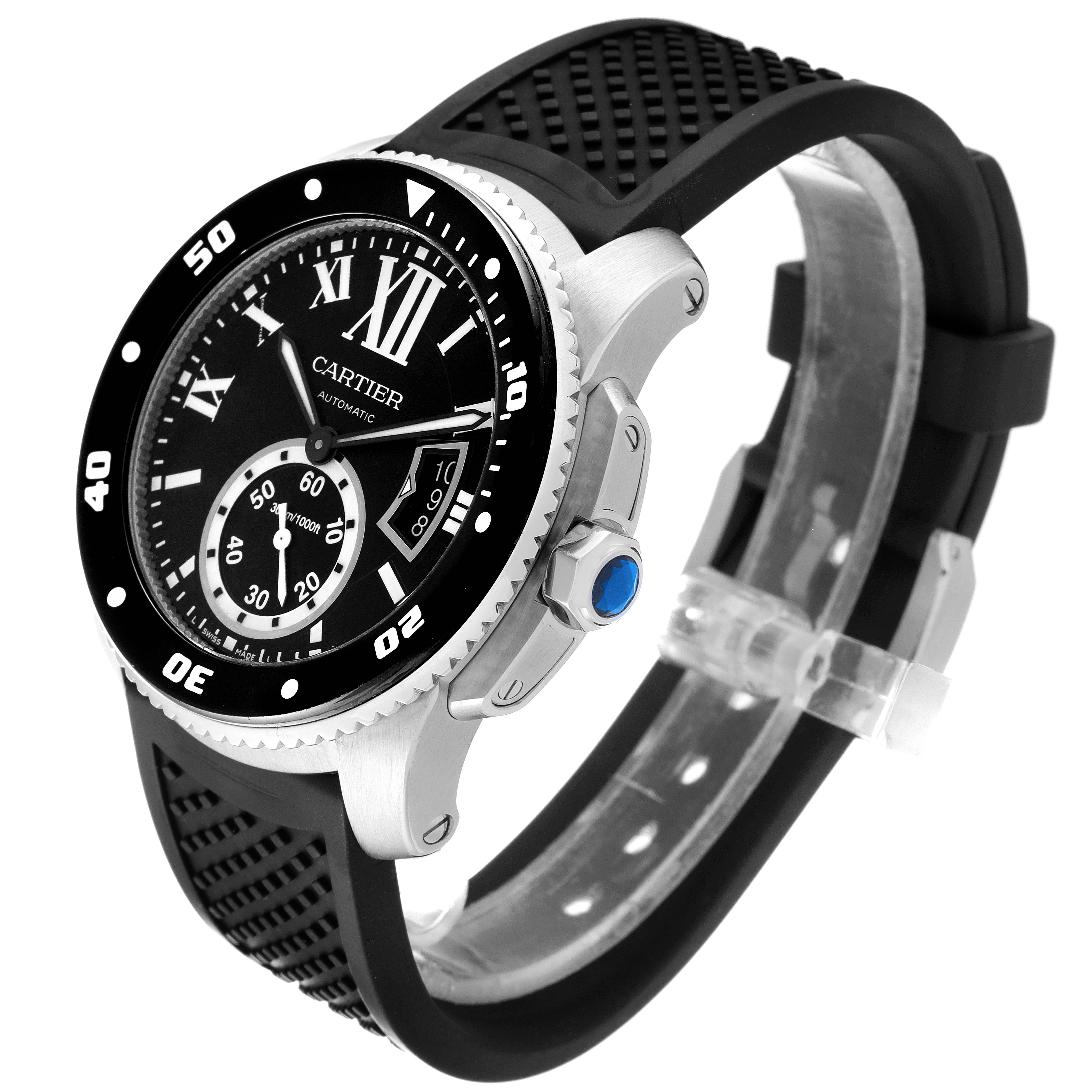 The image shows a Calibre de Cartier watch by Cartier at a three-quarter angle, highlighting the bezel, dial, crown, and strap.