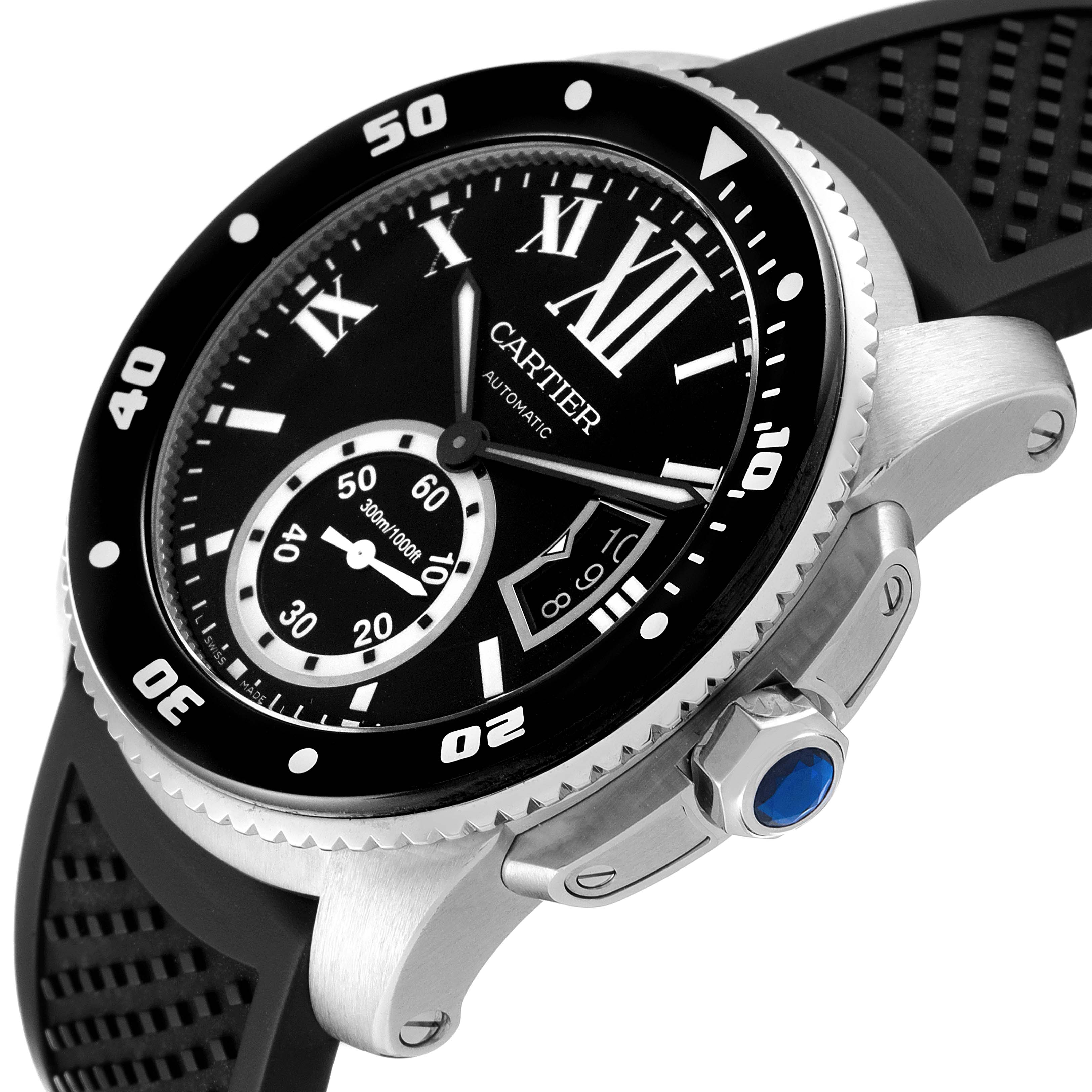 The Calibre de Cartier watch by Cartier is shown at an angle highlighting the dial, bezel, crown, and black rubber strap.