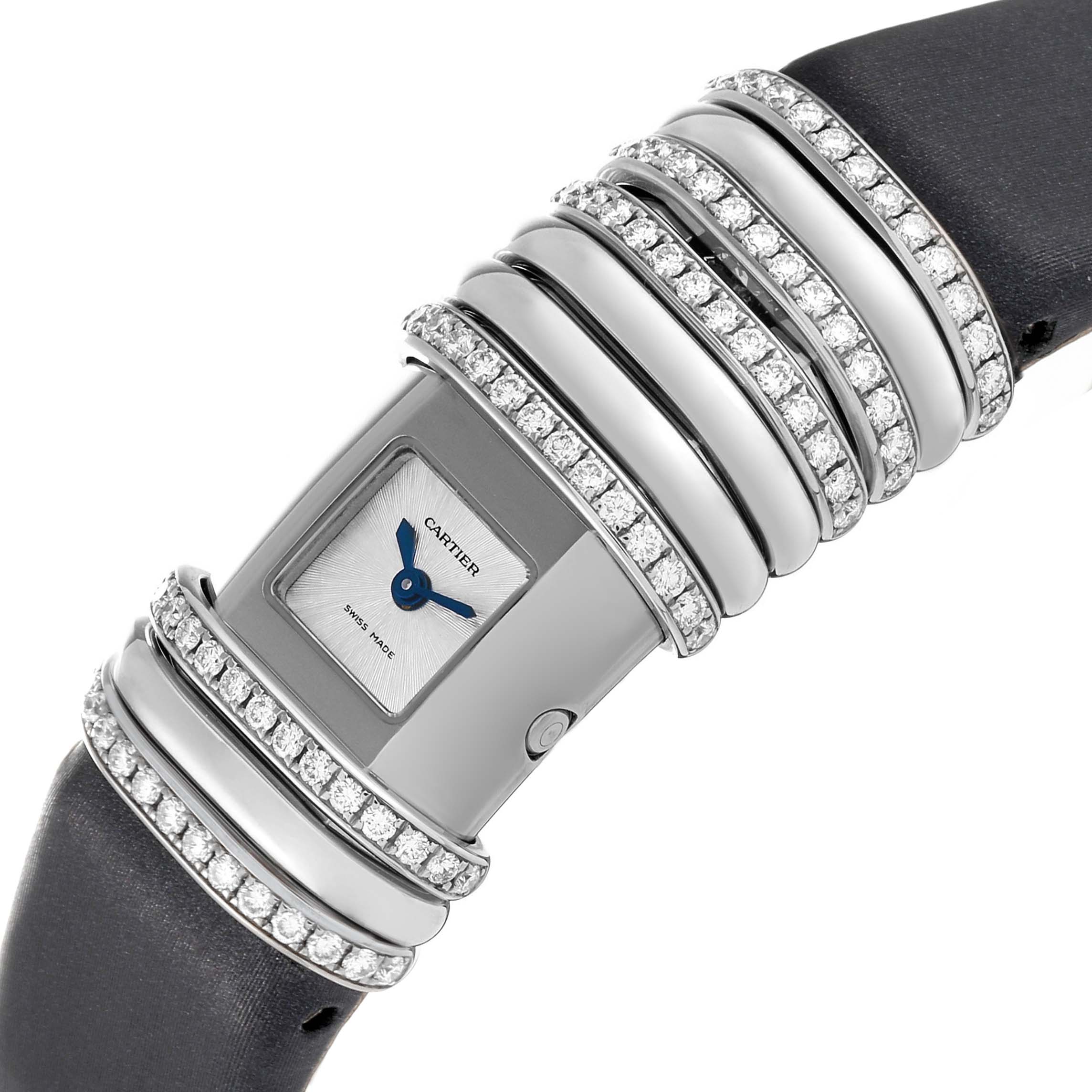 The image shows a close-up of a Cartier Declaration WT000450 Women's Titanium Silver Dial WT000450 Women's Titanium Silver Dial watch featuring a jewel-encrusted bezel and band with a visible face.
