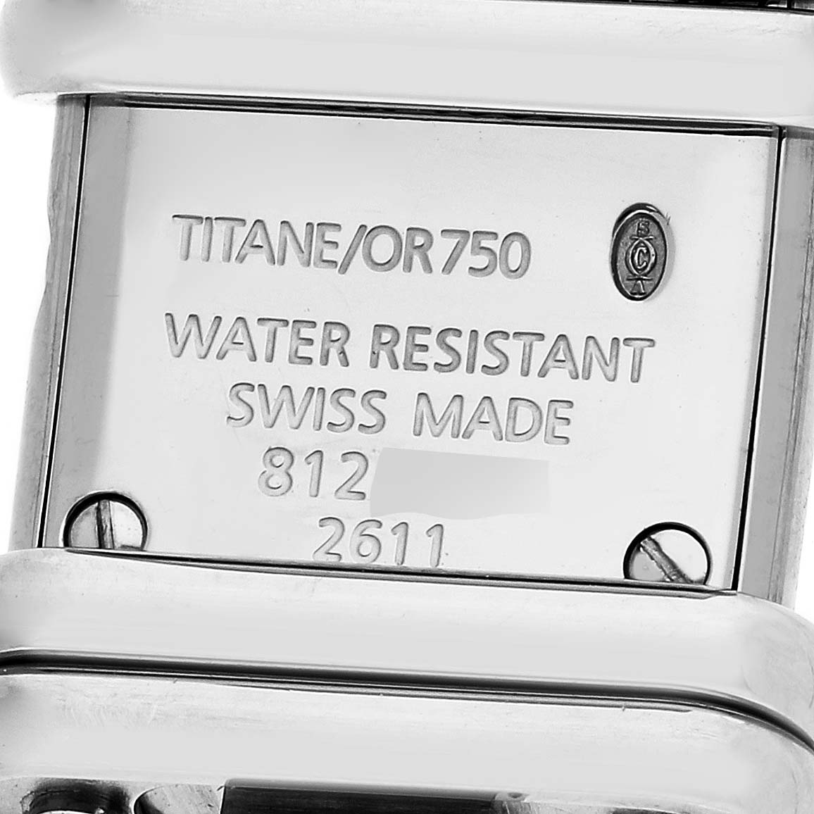 The image shows the back of the Cartier Declaration WT000450 Women's Titanium Silver Dial WT000450 Women's Titanium Silver Dial model watch, highlighting details such as material, water resistance, and serial numbers.