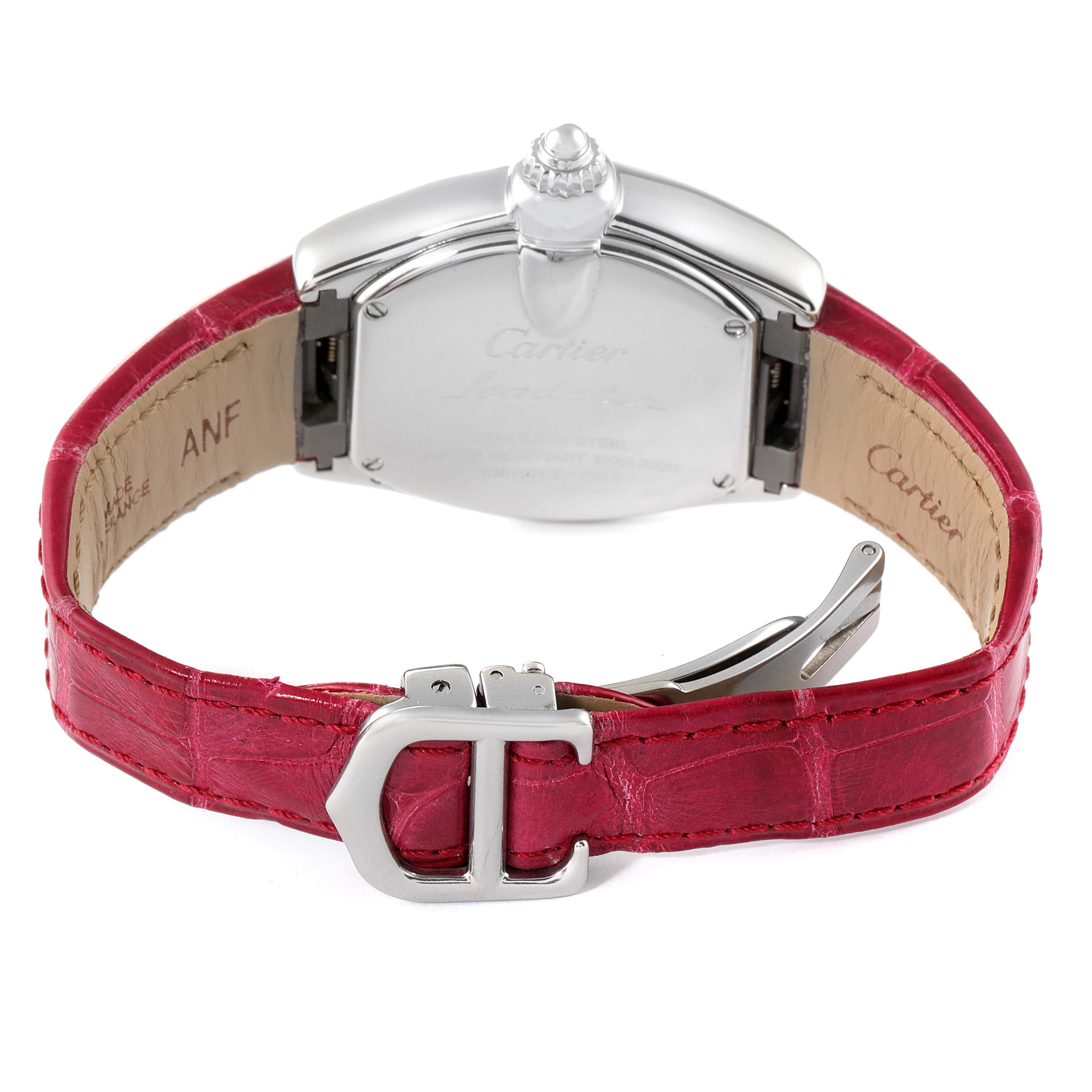 The image shows the back view of a Cartier Roadster W62016V3 Women's Stainless Steel Silver Dial W62016V3 Women's Stainless Steel Silver Dial watch, highlighting the case, crown, and red leather strap with a clasp.
