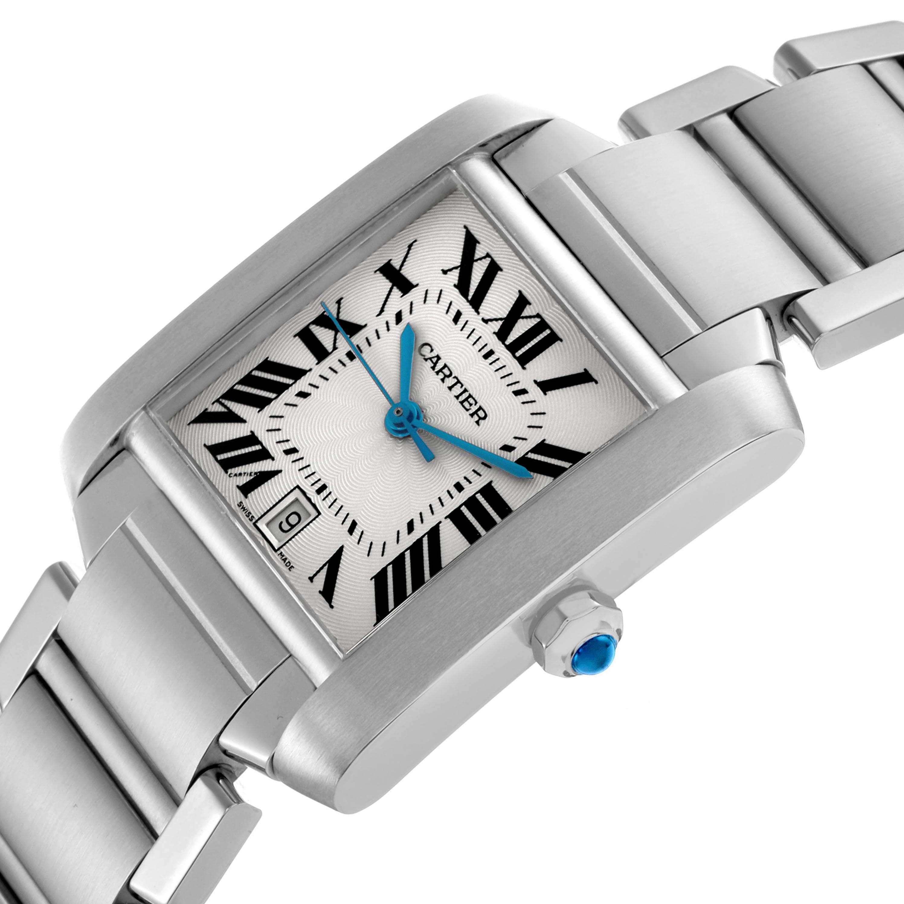 The image shows a Cartier Tank Française watch at an angled view, highlighting the face, Roman numeral markers, blue hands, crown, and part of the metal bracelet.