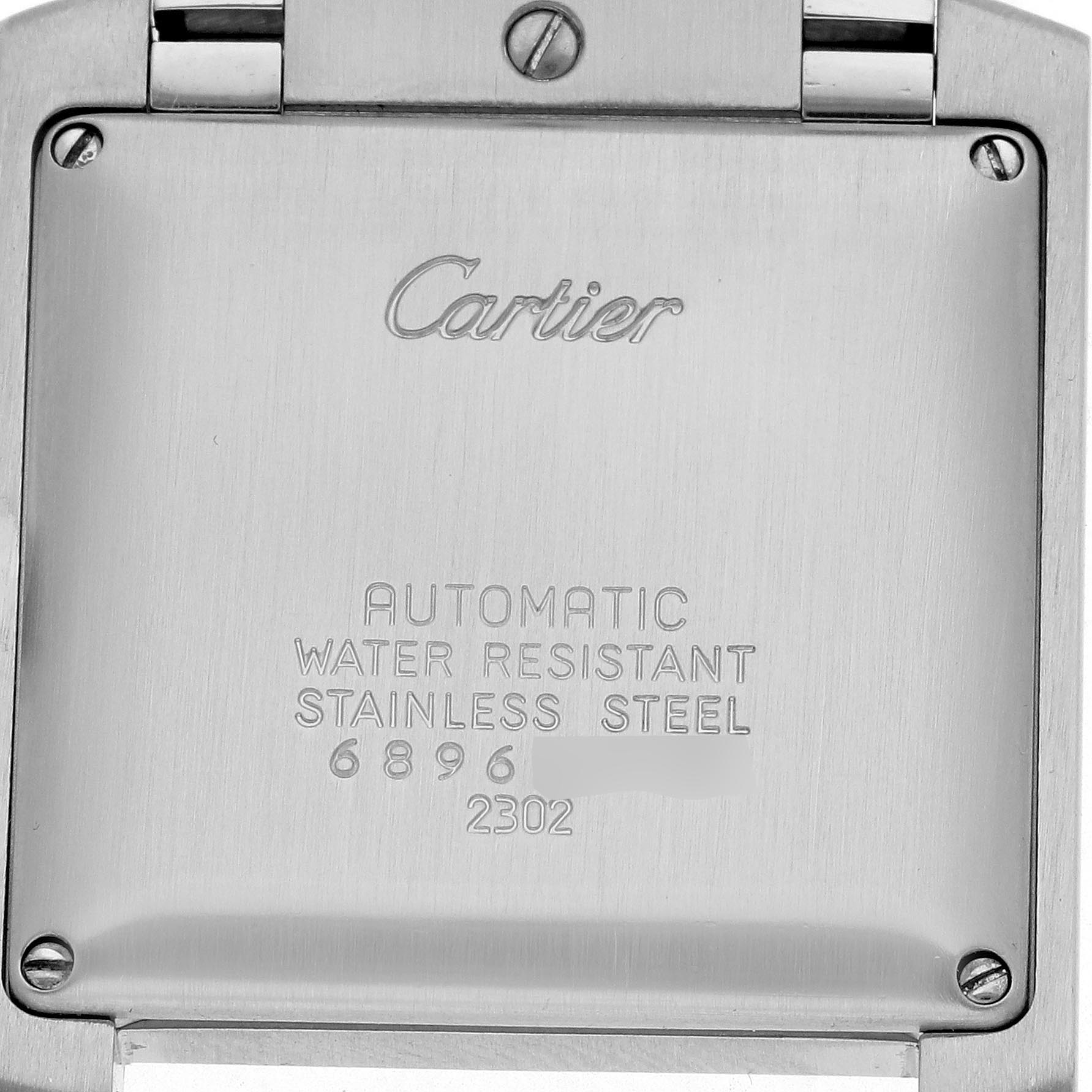 The image shows the back of a Cartier Tank Française watch, highlighting its engraved details and stainless steel casing.