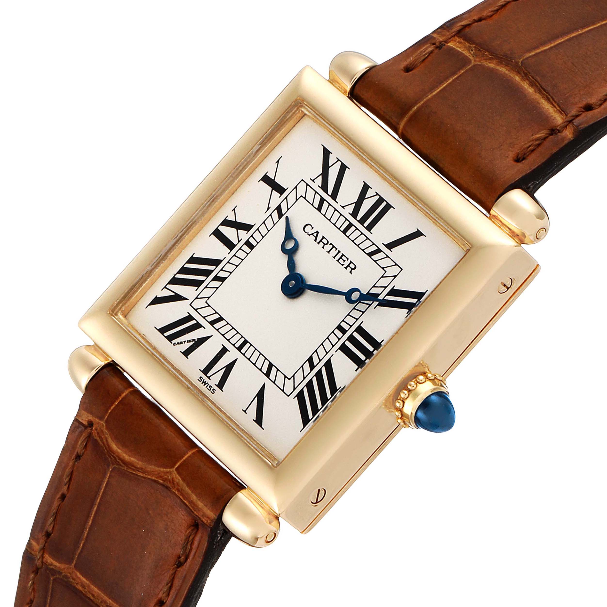 This image shows a Cartier Tank Obus 1630 Women's Yellow Gold Silver Dial 1630 Women's Yellow Gold Silver Dial watch at an angled view, highlighting its gold case, Roman numeral dial, and brown leather strap.
