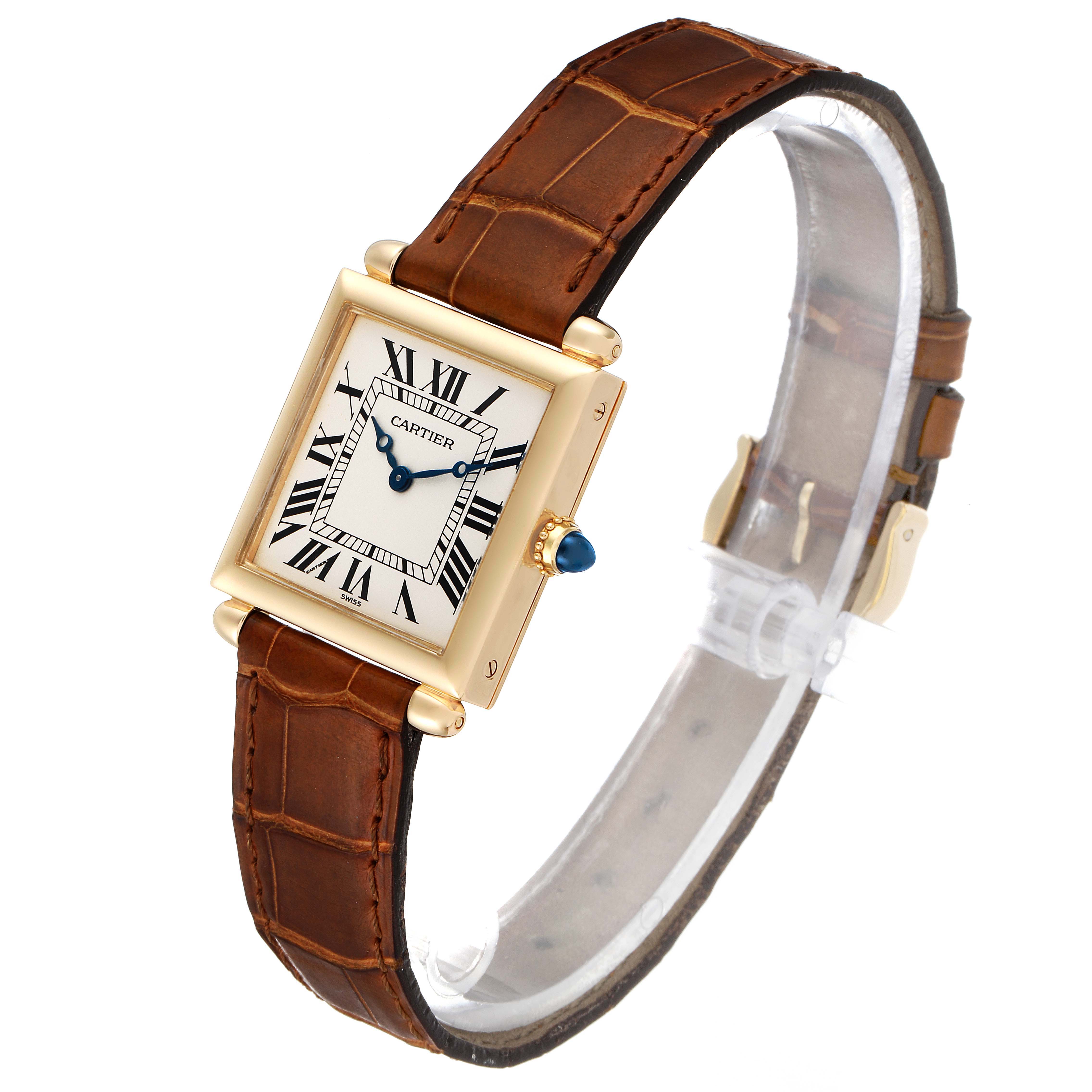 The Cartier Tank Obus 1630 Women's Yellow Gold Silver Dial 1630 Women's Yellow Gold Silver Dial watch is shown from an angled top view, displaying its face, strap, crown, and clasp.