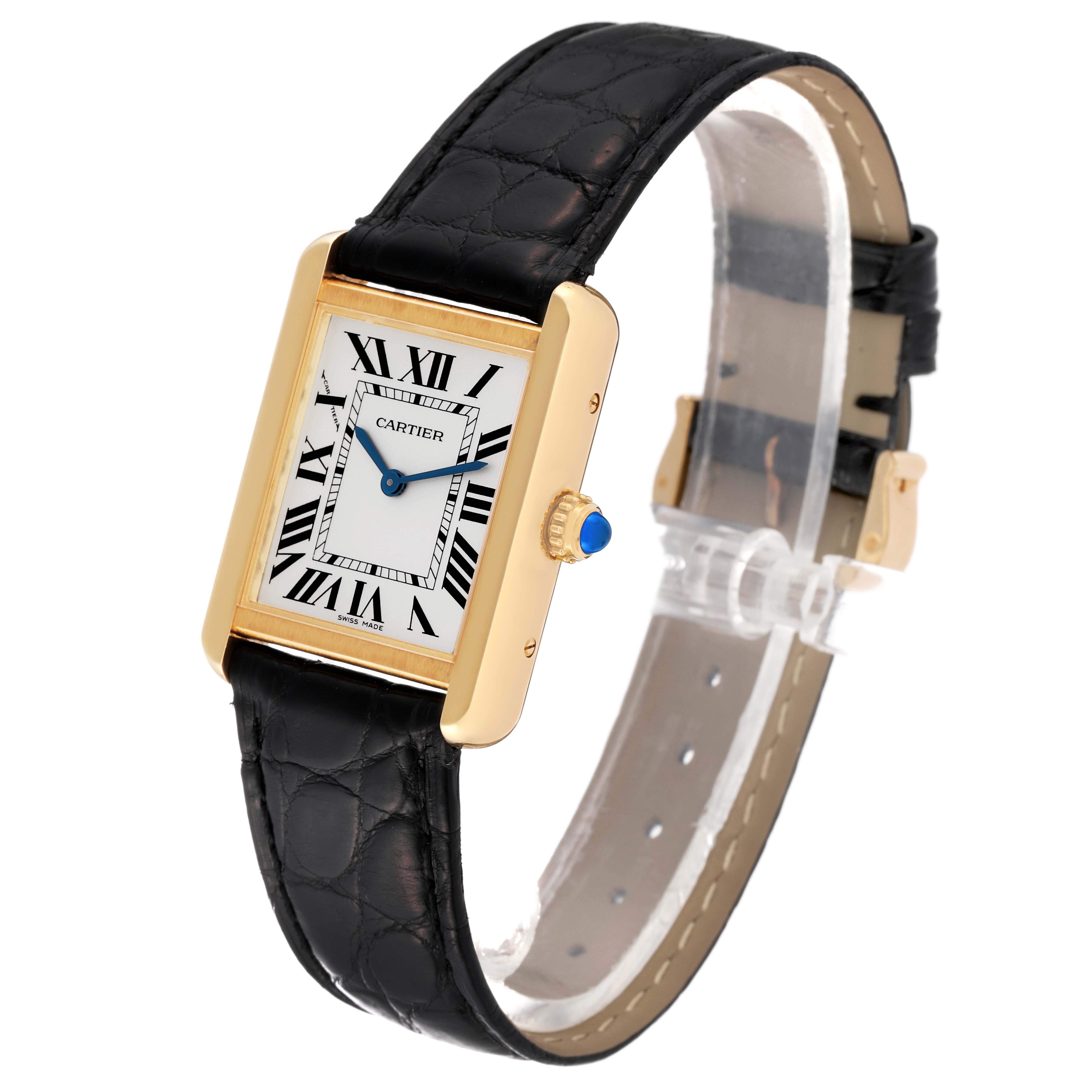 The Cartier Tank Solo W5200002 Women
s Steel and Gold (two tone) Silver Dial W5200002 Women
s Steel and Gold (two tone) Silver Dial model watch is shown at a slight angle, displaying its face, leather strap, and gold casing with a blue cabochon crown.