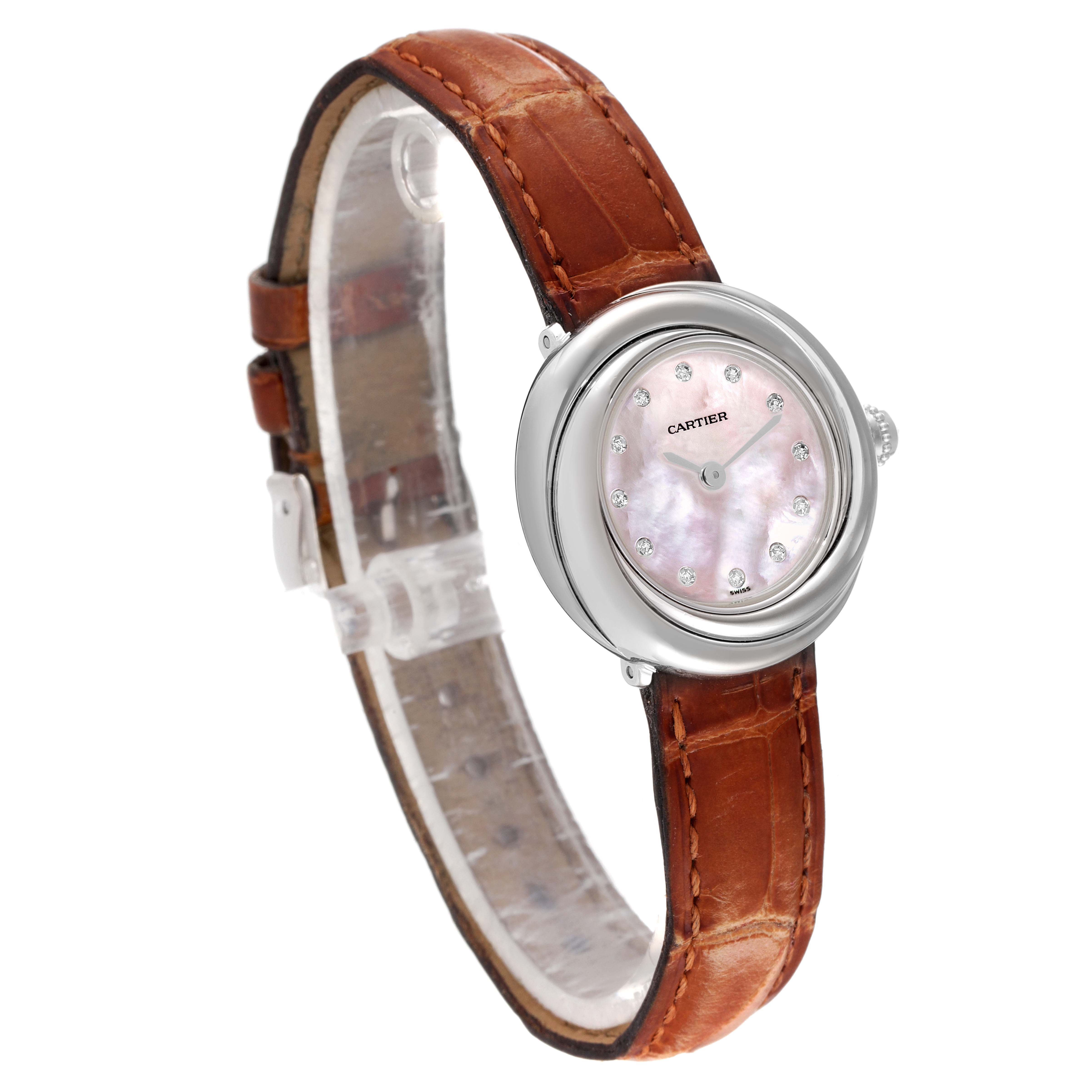 The image shows a Cartier Trinity WG200846 Women's White Gold Mother of Pearl Dial WG200846 Women's White Gold Mother of Pearl Dial model watch with a brown leather strap, silver case, and a mother-of-pearl dial adorned with diamond markers.