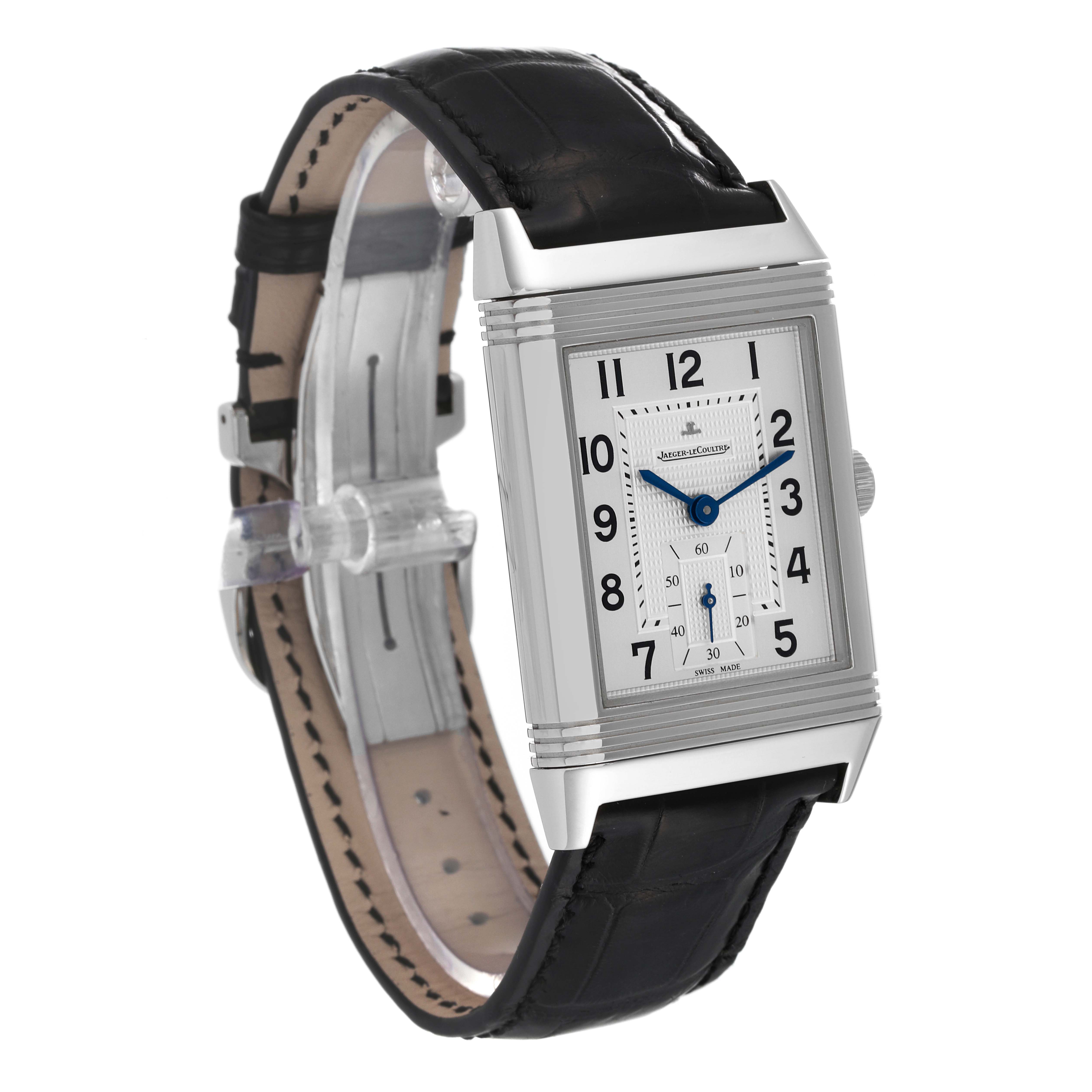 The Jaeger-LeCoultre Reverso watch is shown at a side angle, displaying its rectangular face, leather strap, and visible crown.