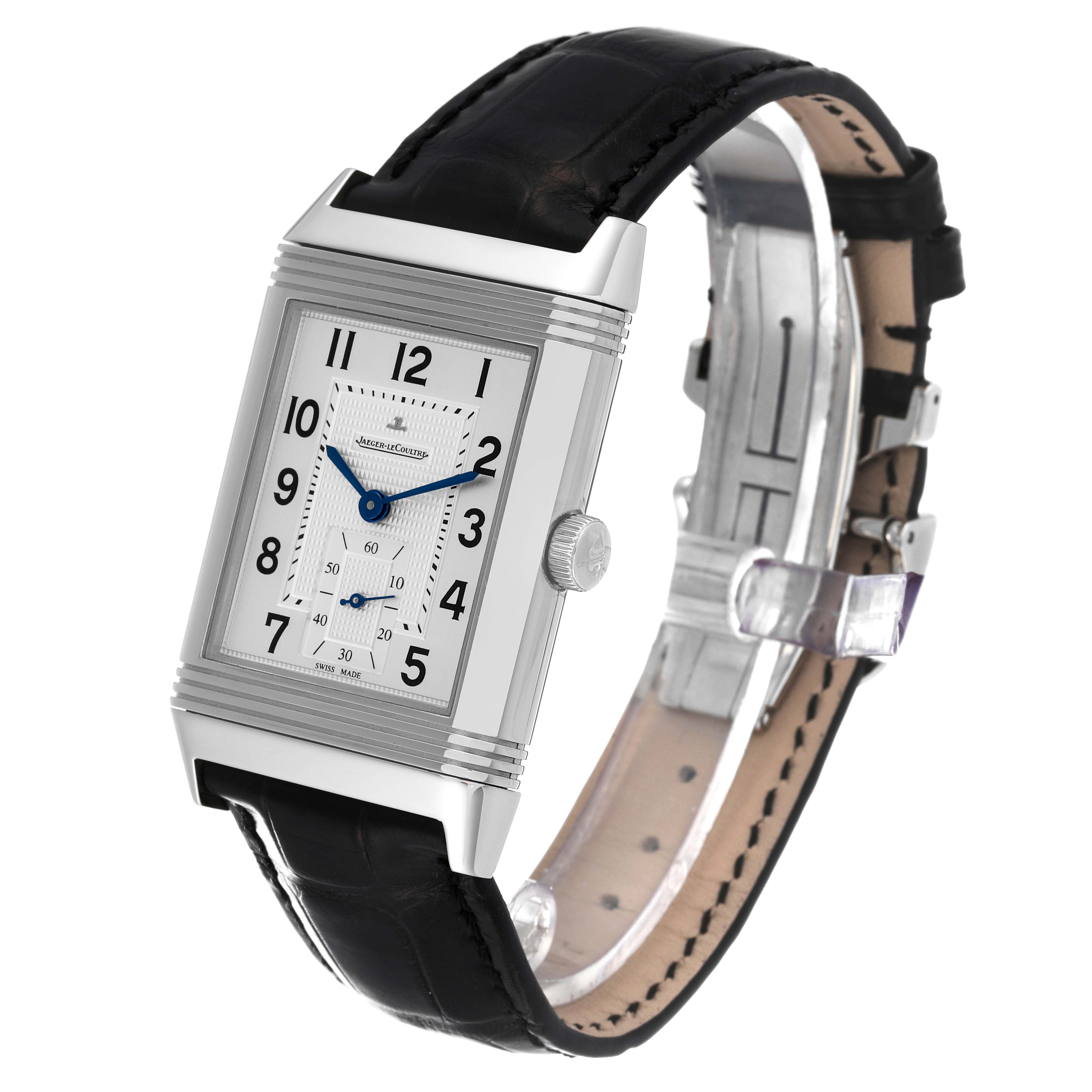 The Jaeger-LeCoultre Reverso watch is shown at a slight angle, displaying its rectangular face, black strap, and clasp.