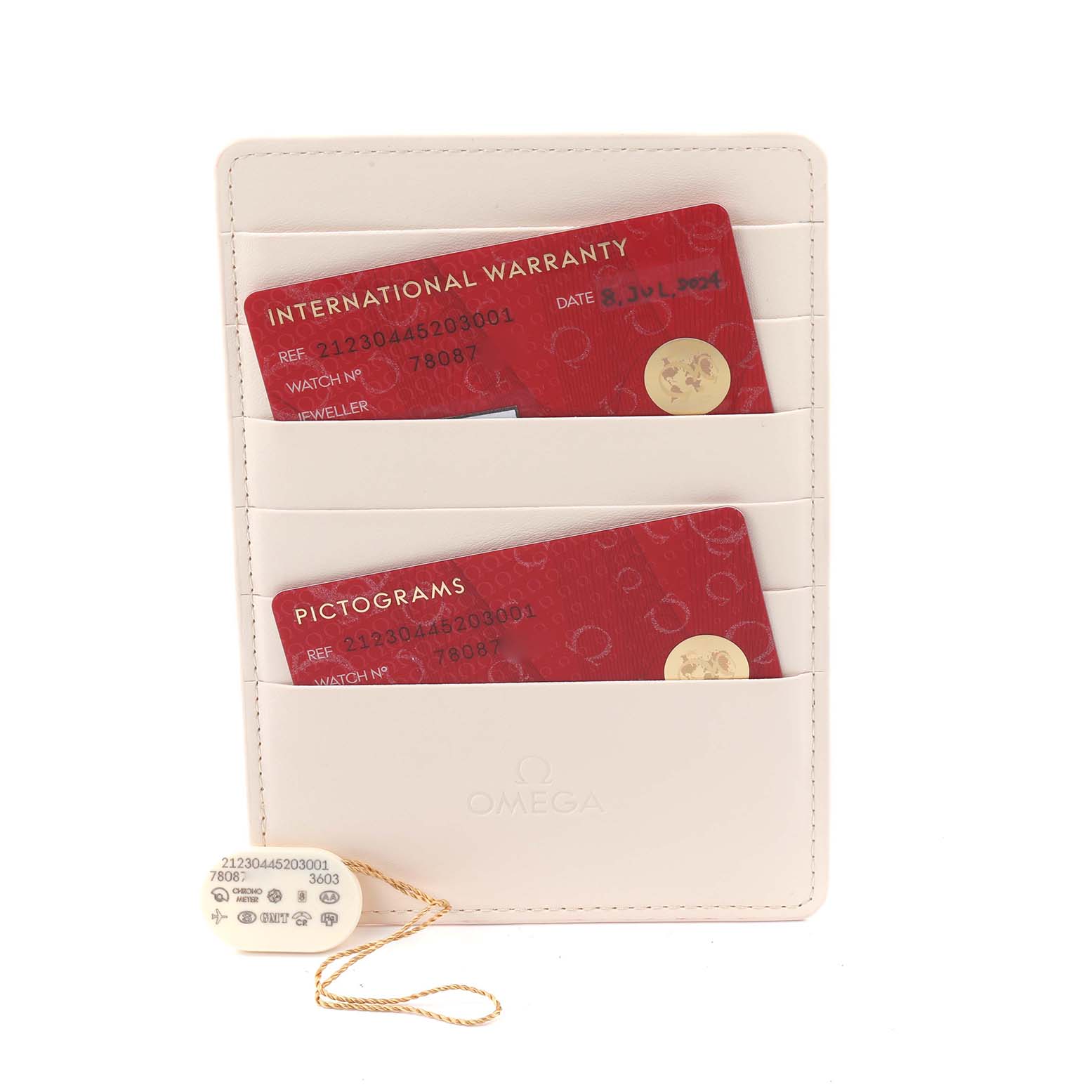 The image shows Omega Seamaster 212.30.44.52.03.001 Men
s Stainless Steel Blue Dial 212.30.44.52.03.001 Men
s Stainless Steel Blue Dial
s warranty and pictogram cards in a cream cardholder with a tag attached.