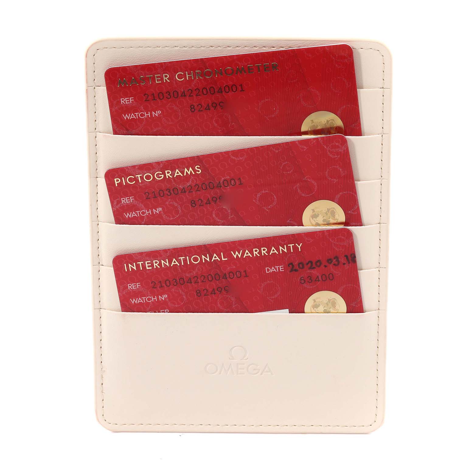 The image shows the warranty cards and documentation holder for the Omega Seamaster 210.30.42.20.04.001 Men
s Stainless Steel White Dial 210.30.42.20.04.001 Men
s Stainless Steel White Dial, viewed from a top-down angle.