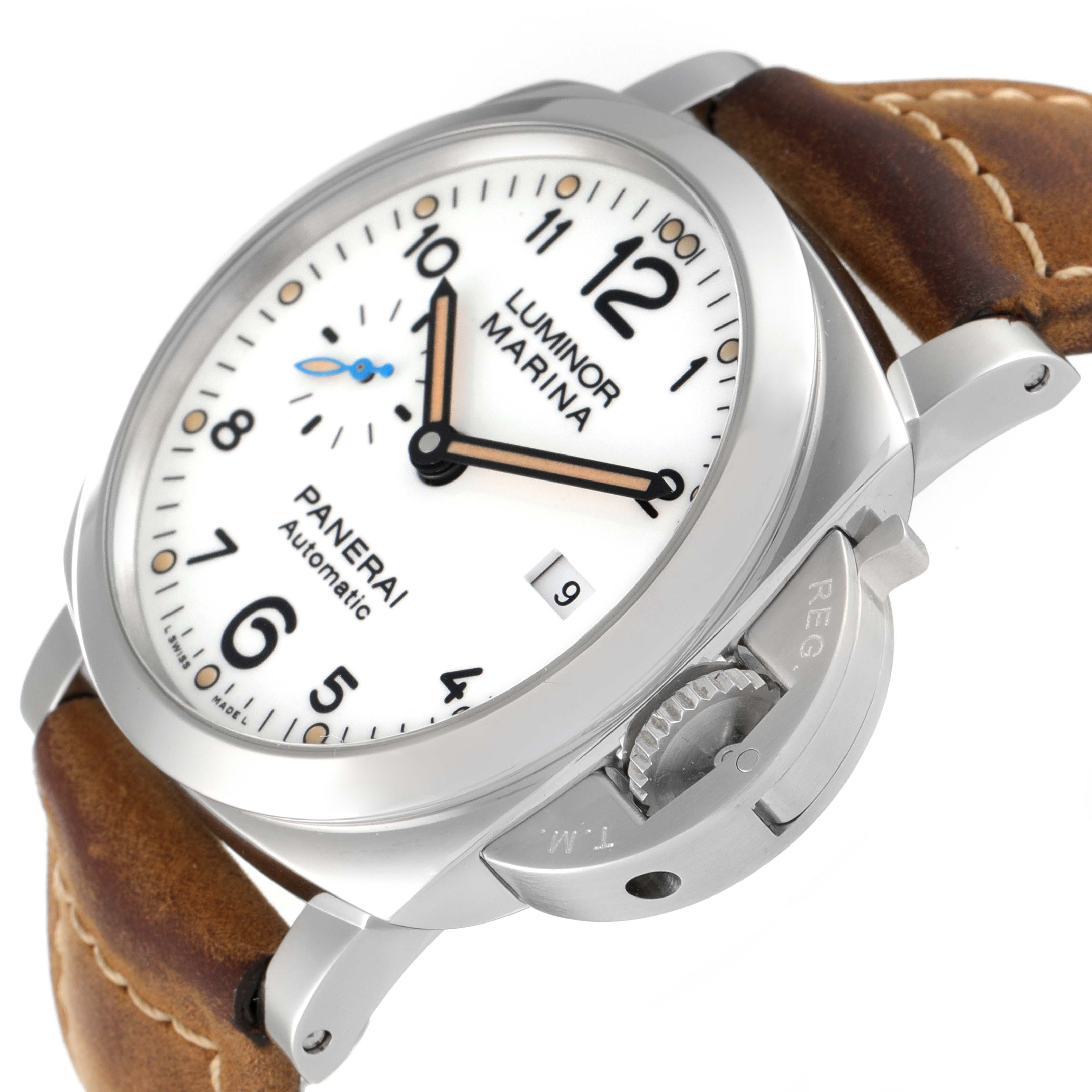 This image shows a close-up of the Panerai Luminor PAM01499 Men
s Stainless Steel White Dial PAM01499 Men
s Stainless Steel White Dial Marina watch displaying its watch face, crown guard, and brown leather strap.