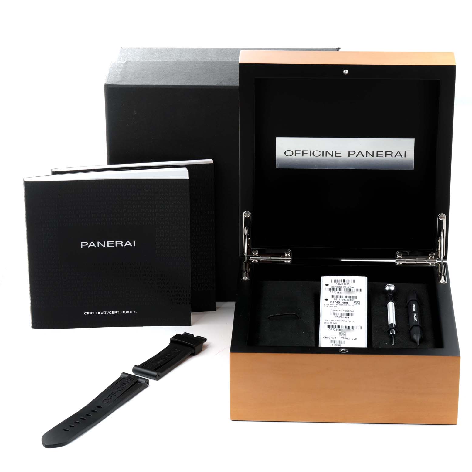 The image shows a Panerai Luminor PAM01499 Men
s Stainless Steel White Dial PAM01499 Men
s Stainless Steel White Dial watch box, additional strap, booklets, and tools from a front angle.