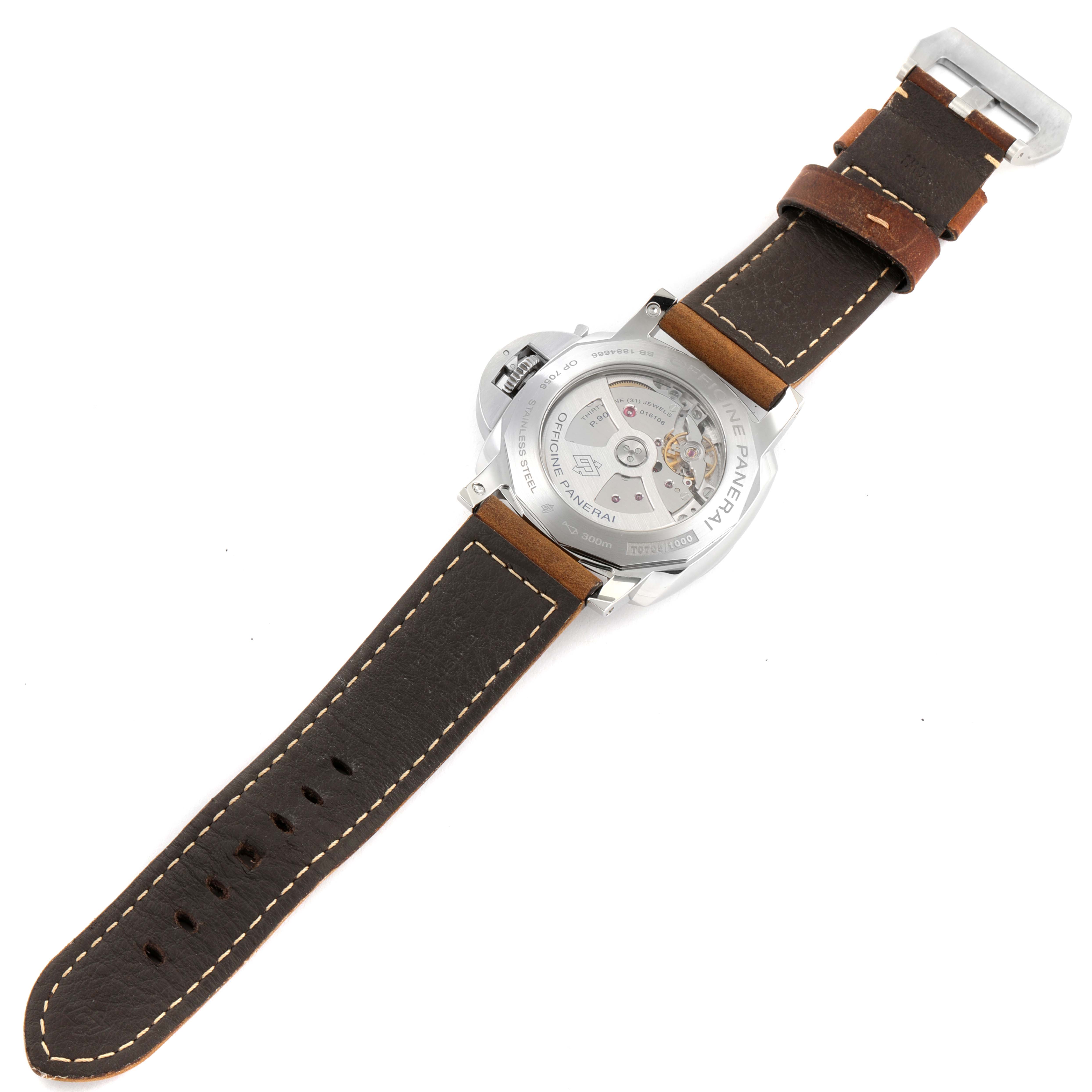 The image shows the back view of a Luminor model watch by Panerai, highlighting the case back and leather strap.