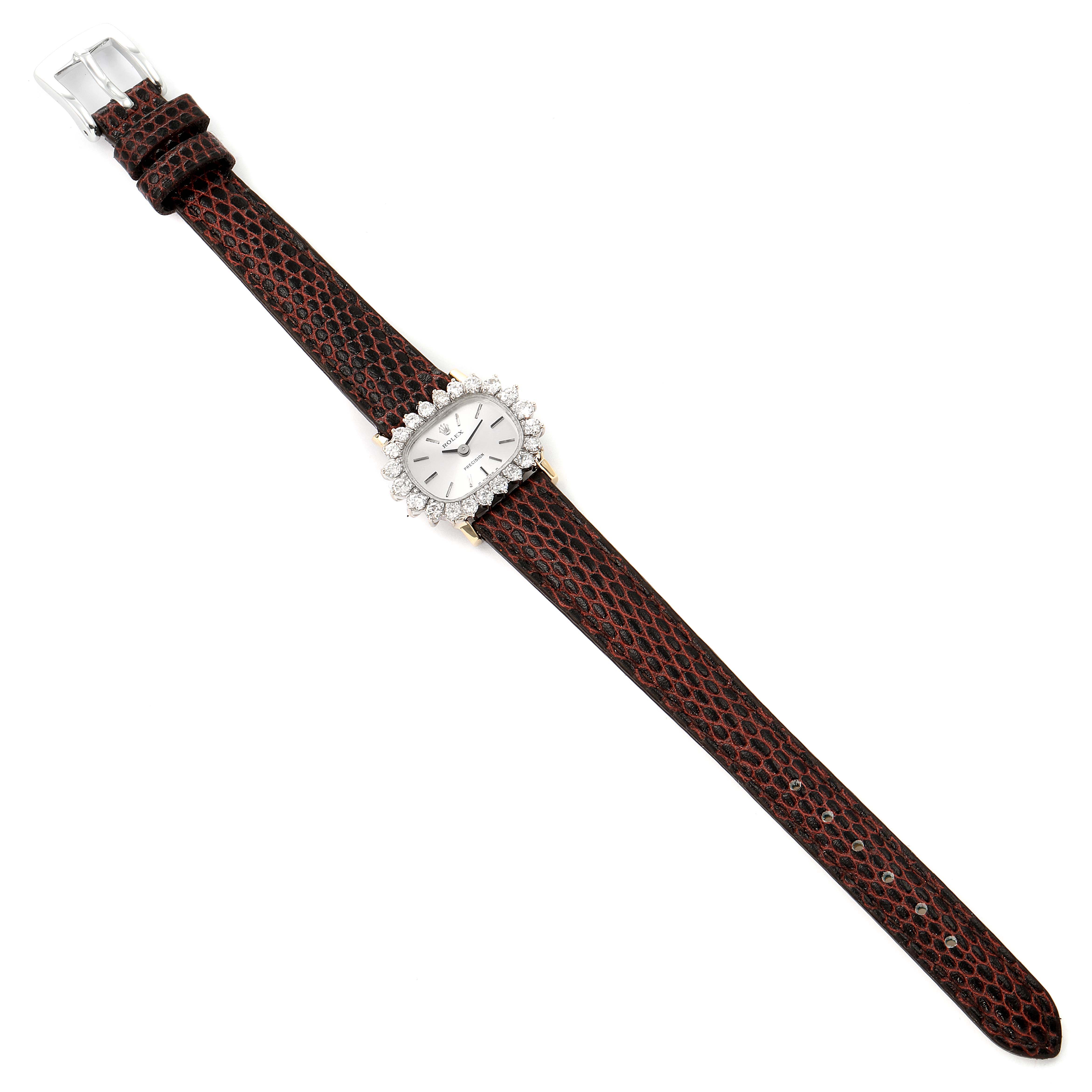 The image shows a Rolex Cocktail  Women's White Gold Silver Dial  Women's White Gold Silver Dial model watch, viewed from above, featuring its dial, diamond bezel, and leather strap with a buckle.