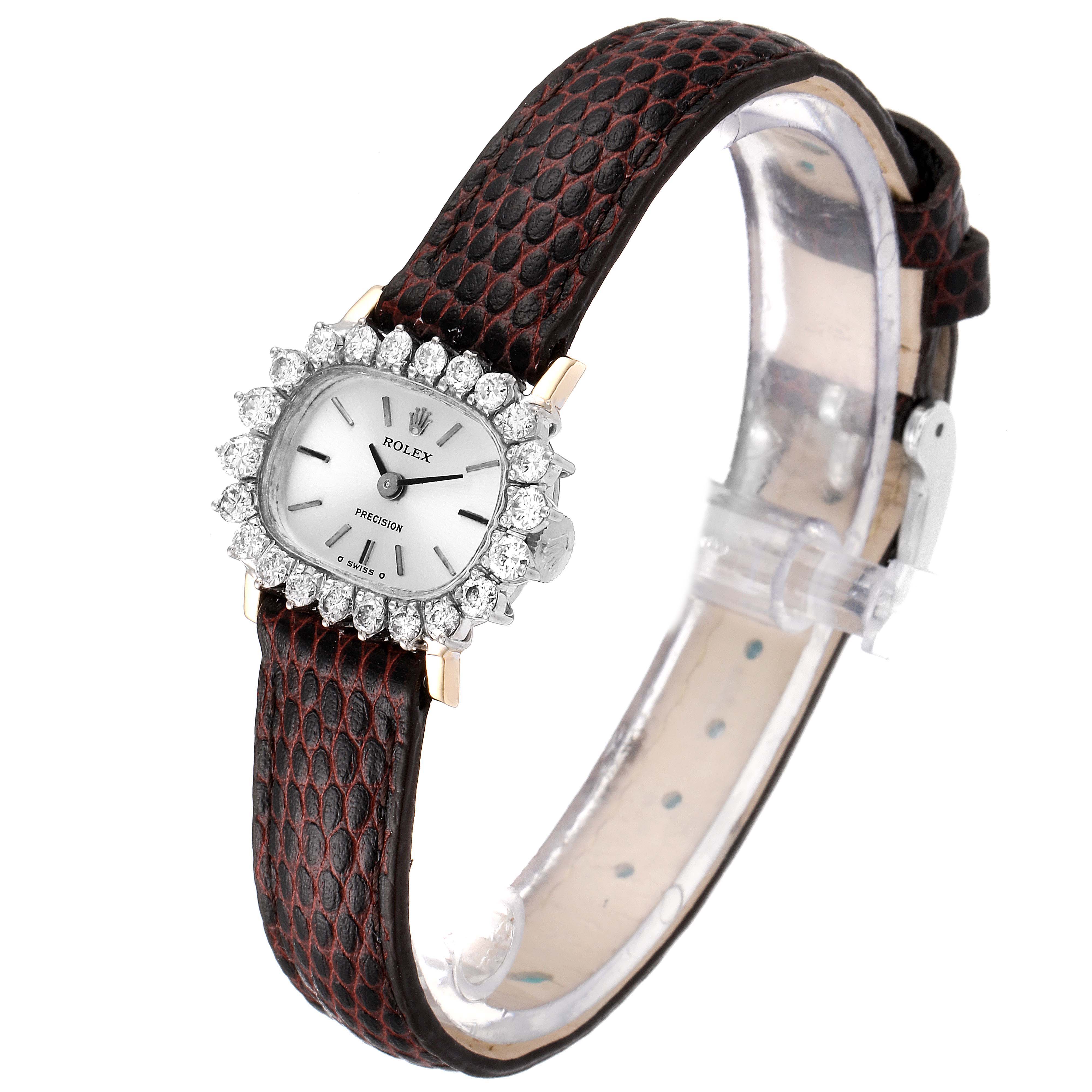 The image shows a Rolex Cocktail  Women's White Gold Silver Dial  Women's White Gold Silver Dial model watch with a leather strap and diamond bezel at an angled side view.