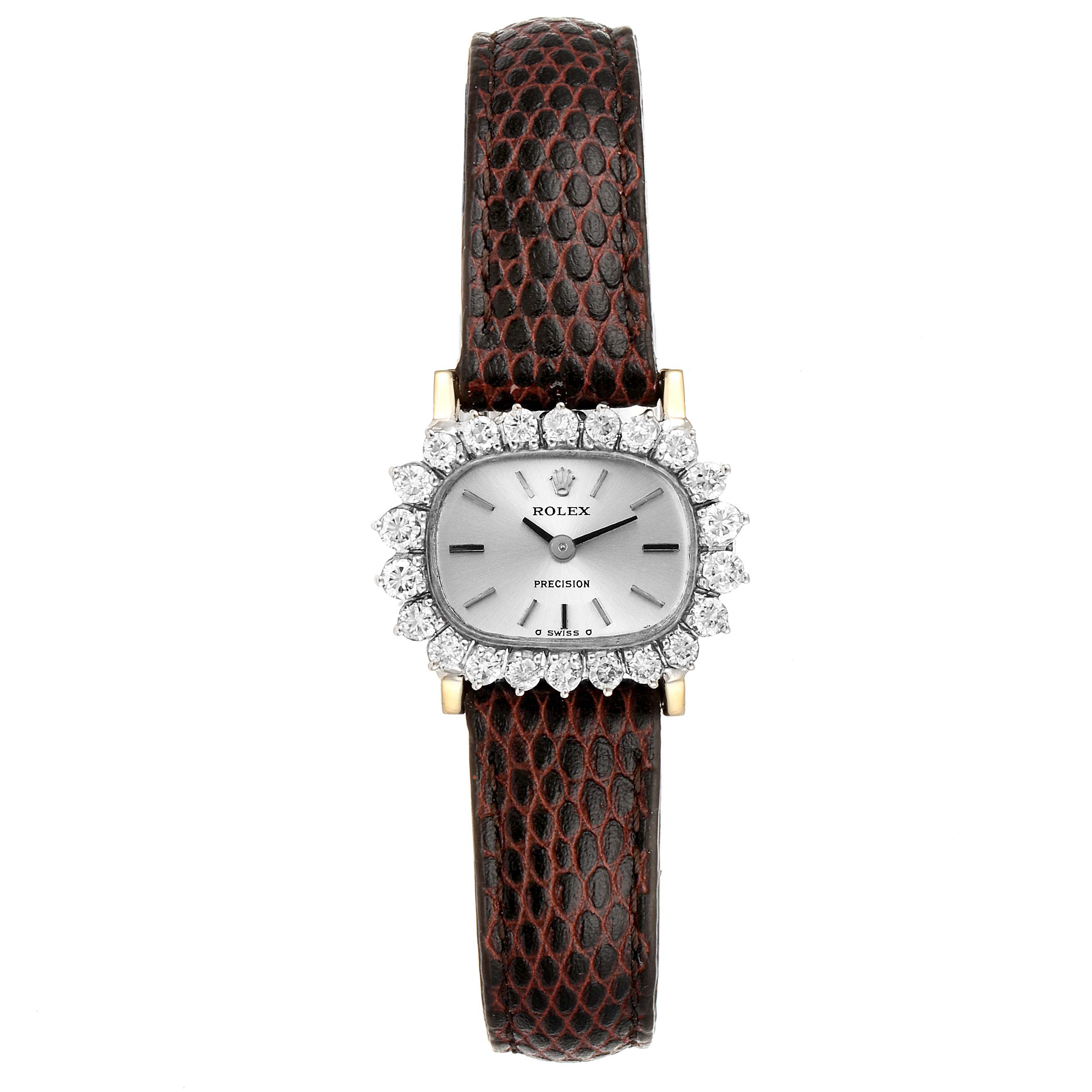 The image shows the front view of a Rolex Cocktail  Women's White Gold Silver Dial  Women's White Gold Silver Dial model watch, featuring a circular diamond bezel and brown strap.
