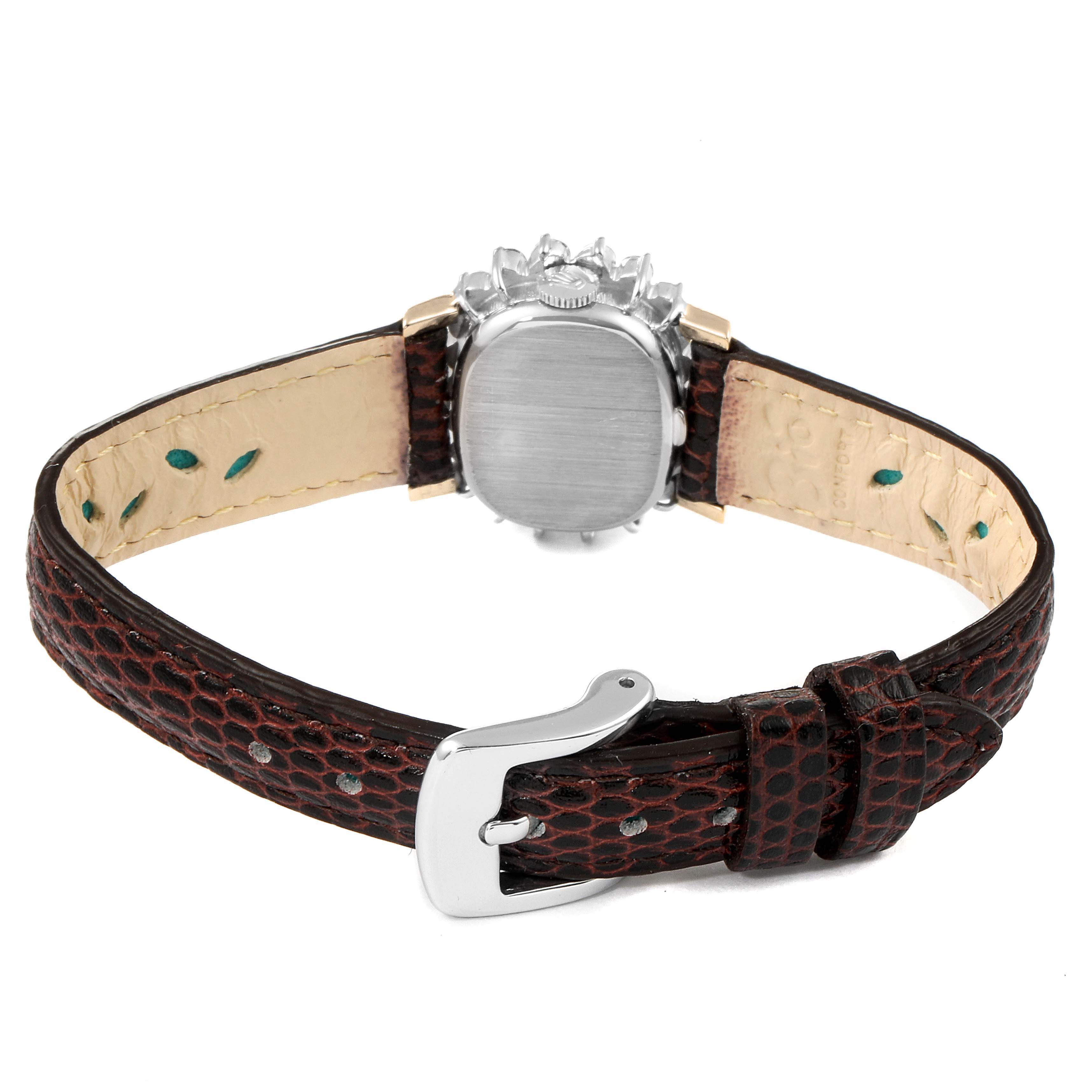 The image shows a rear view of a Rolex Cocktail  Women's White Gold Silver Dial  Women's White Gold Silver Dial model watch, including the case back and leather strap with buckle.