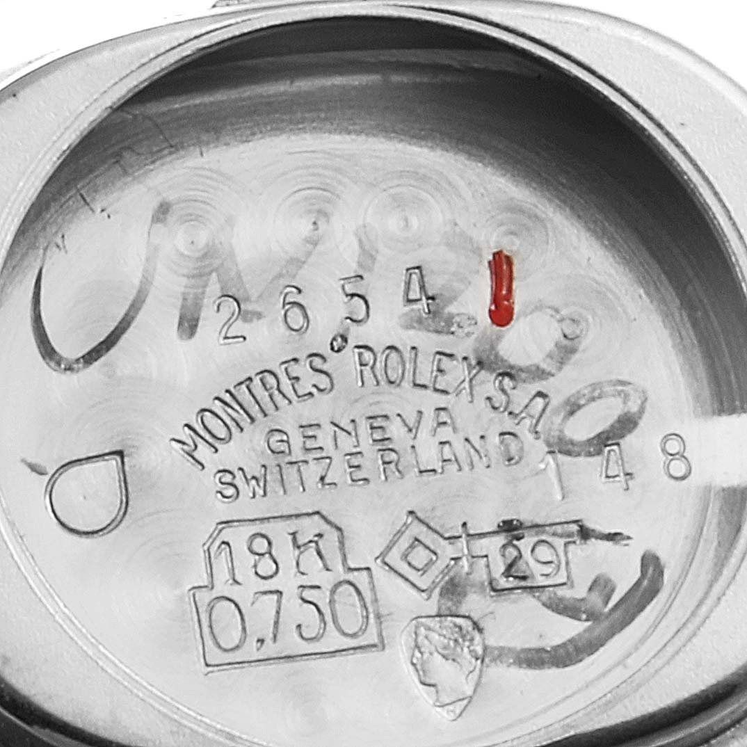 This image shows the inner case back of a Cocktail model Rolex watch, featuring hallmark stamps and engravings.