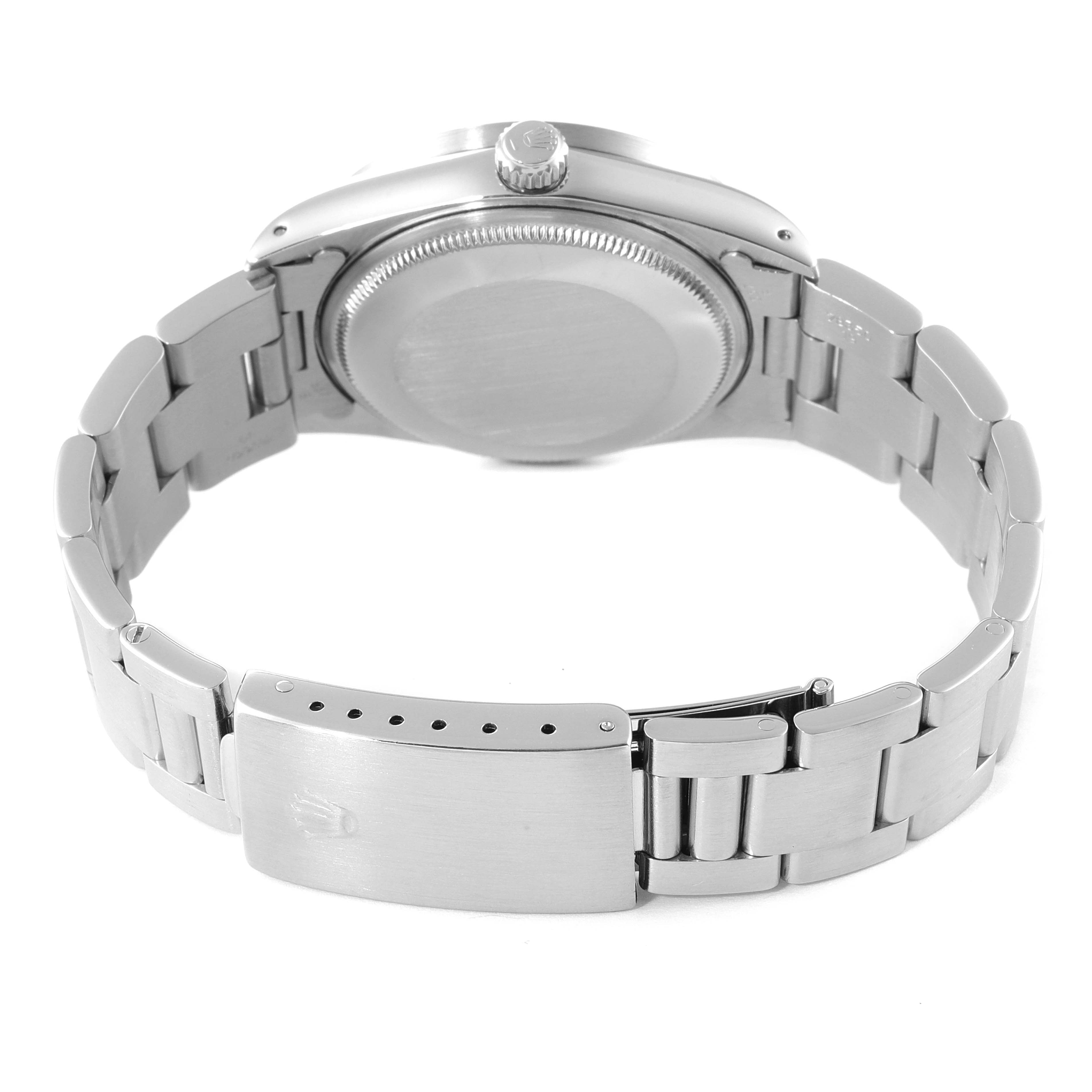 This image shows the back view of a Rolex Air-King 14010 Men's Stainless Steel Silver Dial 14010 Men's Stainless Steel Silver Dial watch, emphasizing its case back, crown, and bracelet clasp.