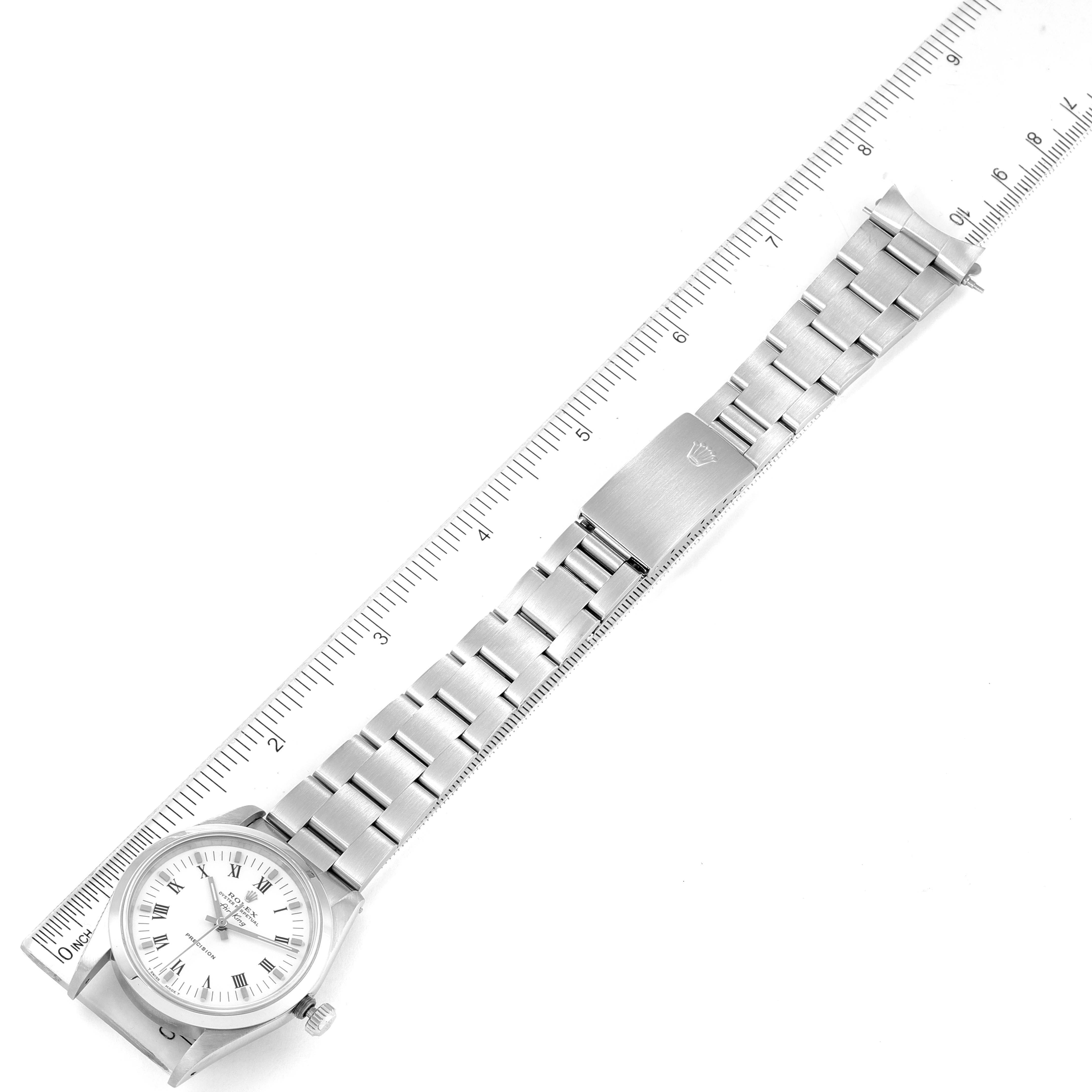 The image shows a top-down view of the Air-King Rolex watch with the band fully extended beside a ruler.