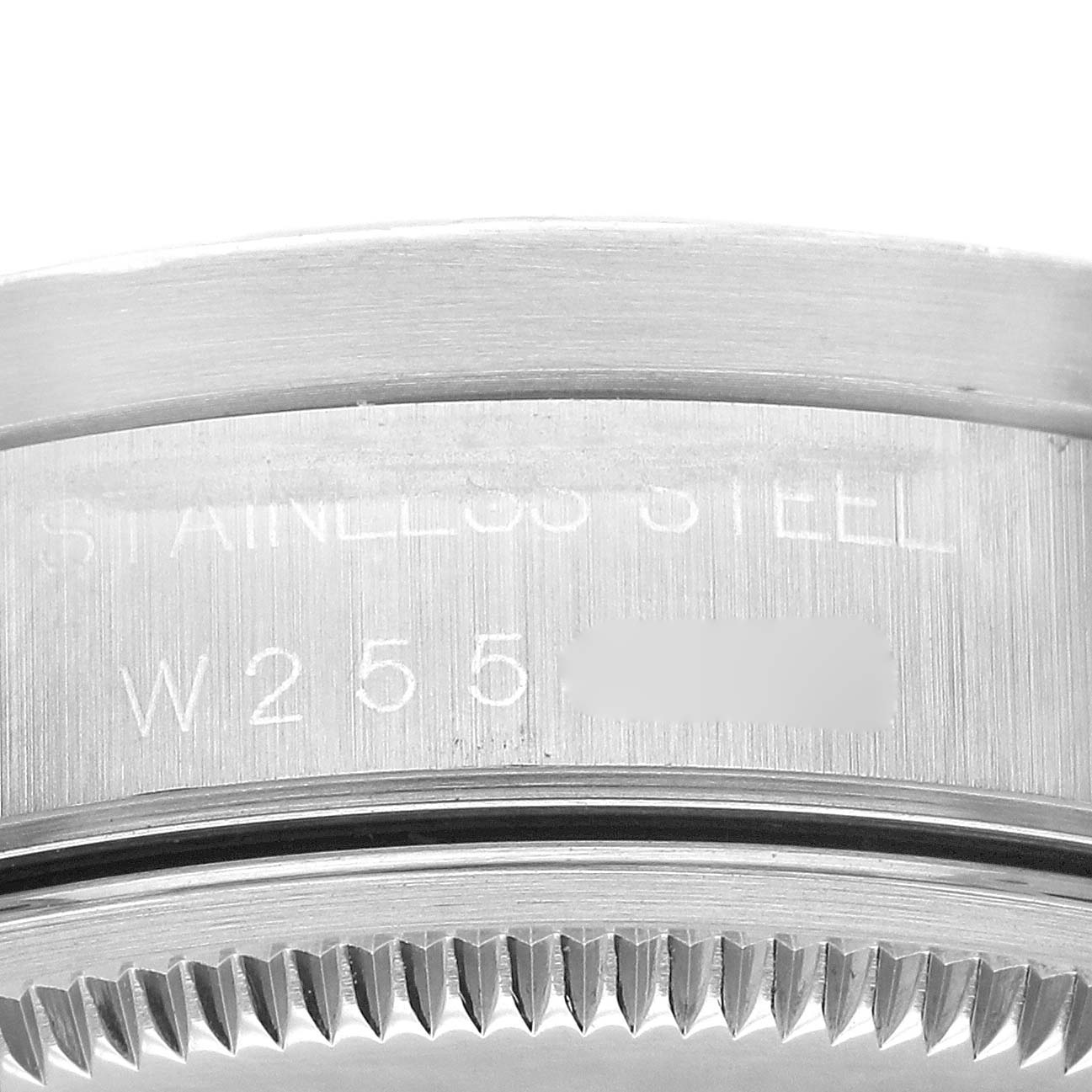 This image shows a close-up angle of the case back's edge and the engraving on the Rolex Air-King 14010 Men's Stainless Steel White Dial 14010 Men's Stainless Steel White Dial watch.