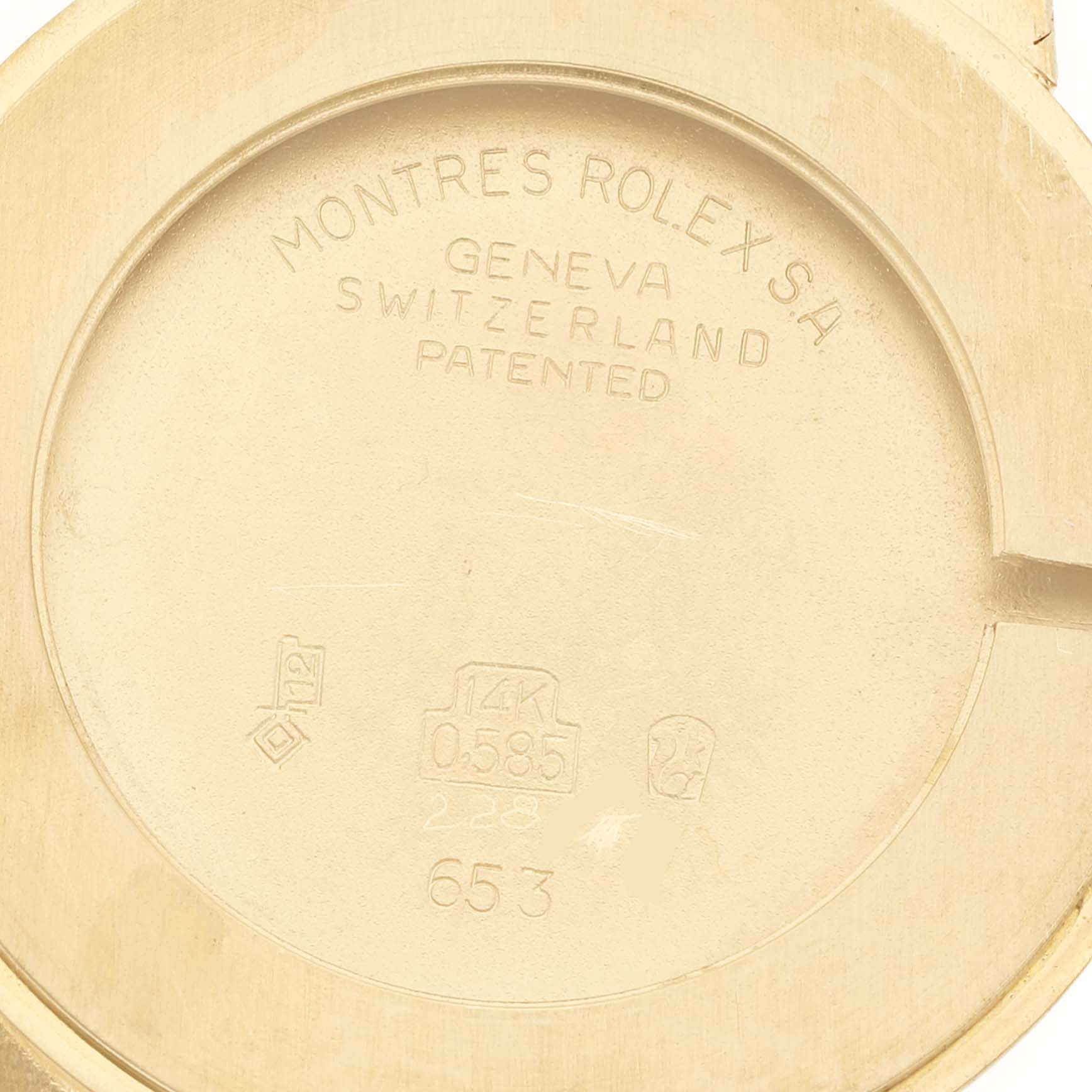 This image shows the inside case back of a Rolex Cellini 653 Women's Yellow Gold Champagne Dial 653 Women's Yellow Gold Champagne Dial watch, engraved with "Montres Rolex SA Geneva Switzerland Patented."