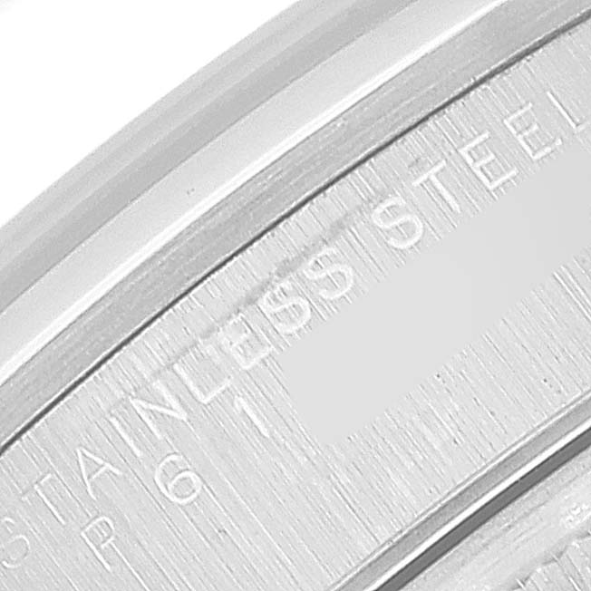 The image shows the engraved inner bezel of a Rolex Date 15200 Men's Stainless Steel Blue Dial 15200 Men's Stainless Steel Blue Dial model watch, highlighting "STAINLESS STEEL."